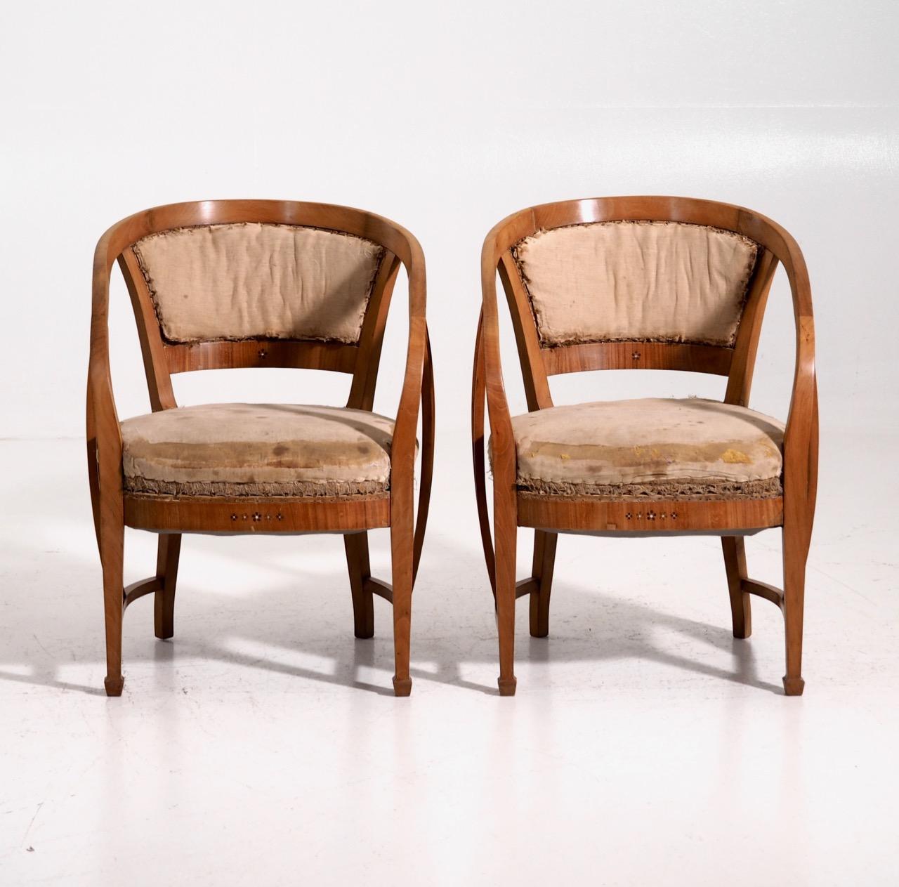 Pair of very rare Art Nouveau armchairs. Probably by one of the famous Austrian architects, made in cherrywood. Inlaid with mother of pearl and with various fruitwood, circa 1905.