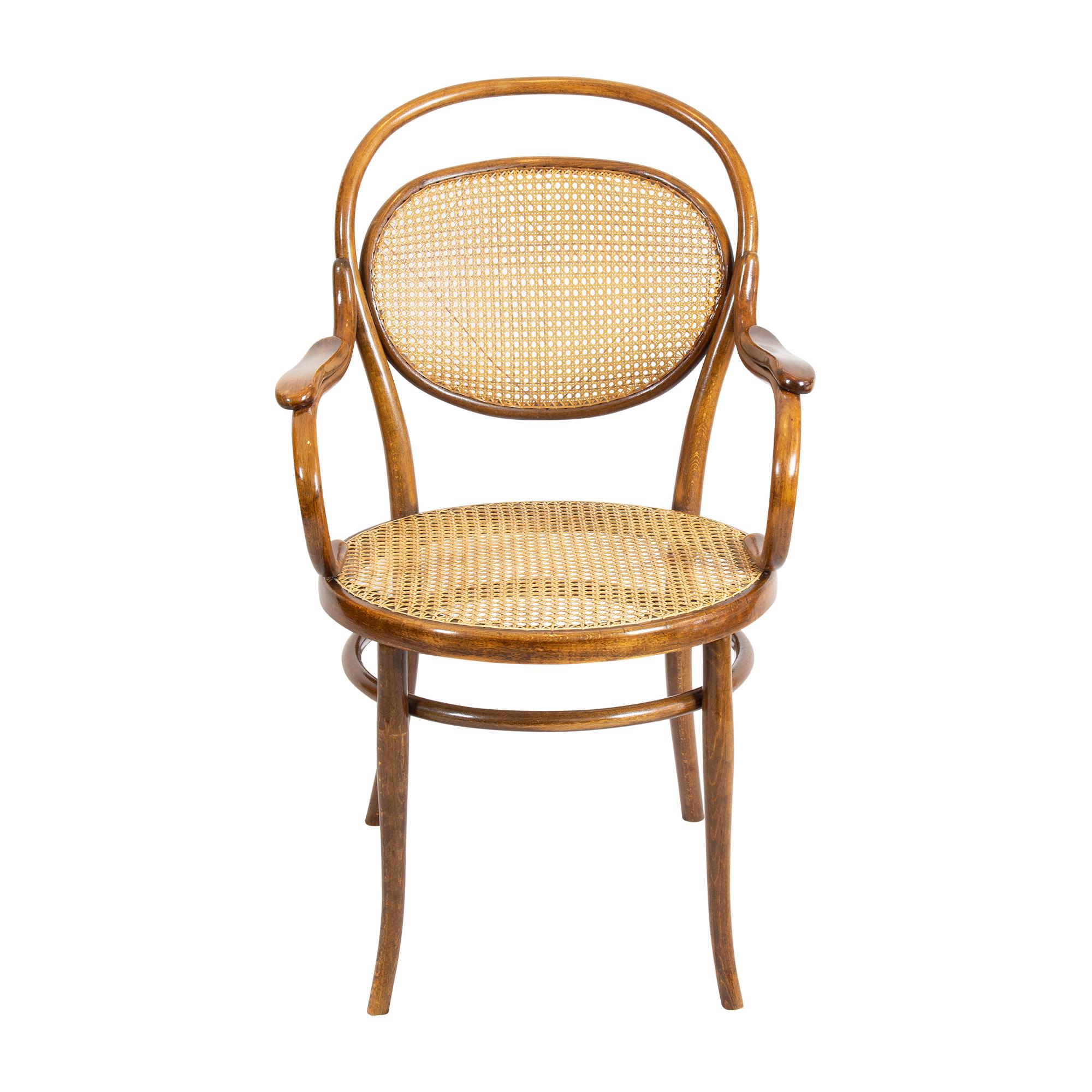 Art Nouveau armchair was built by Thonet company from bentwood. The seat as well as the backrest are made with a so-called Viennese weave. The chair is in a good restored condition.