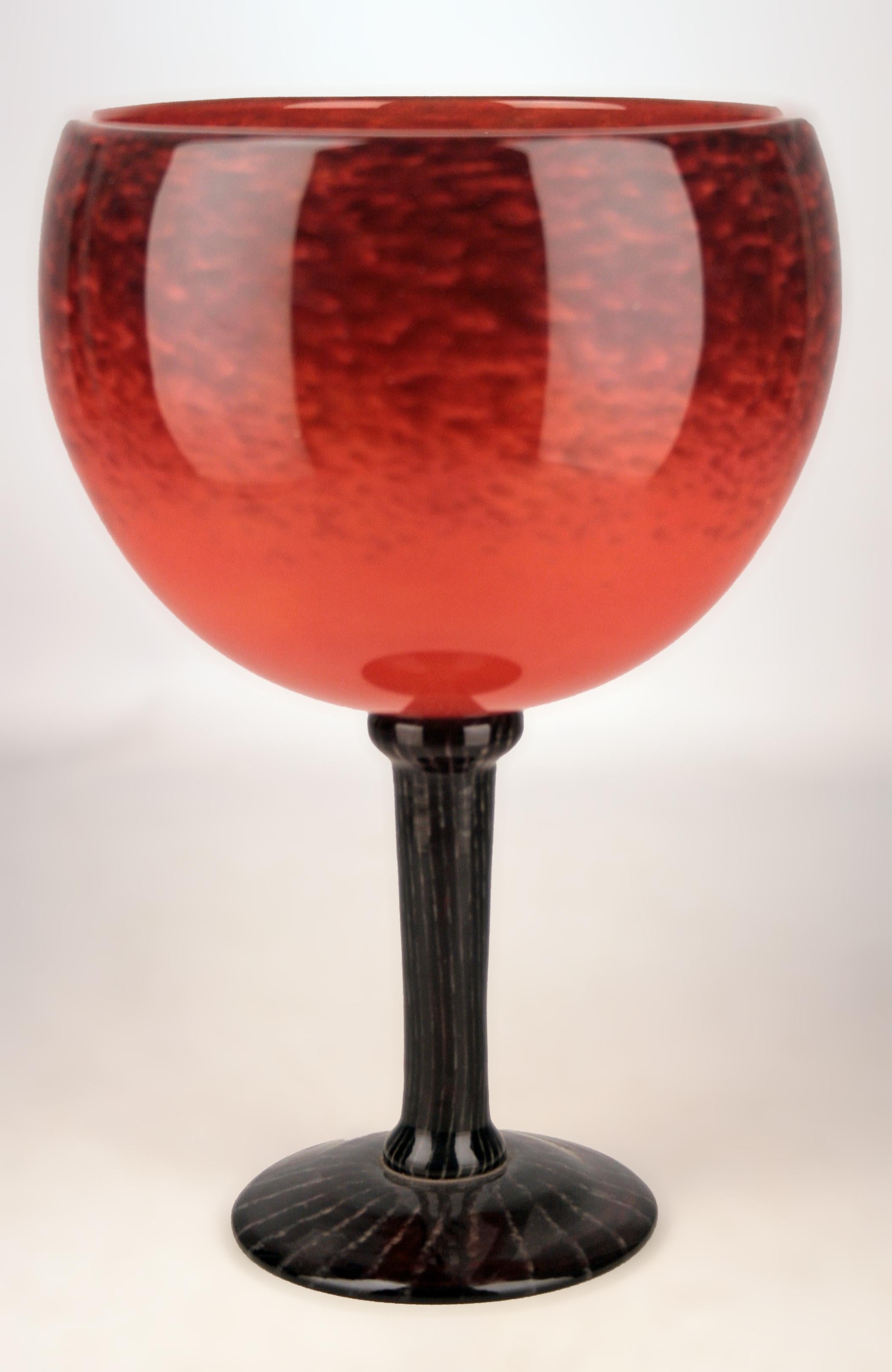 Early 20th century Art Déco french art glass footed vase by german artist Charles Schneider

By: Charles Schneider
Material: art glass, glass
Technique: cast, glazed, polished
Dimensions: 8 in x 11.5 in
Date: early 20th century, circa 1920
Style: