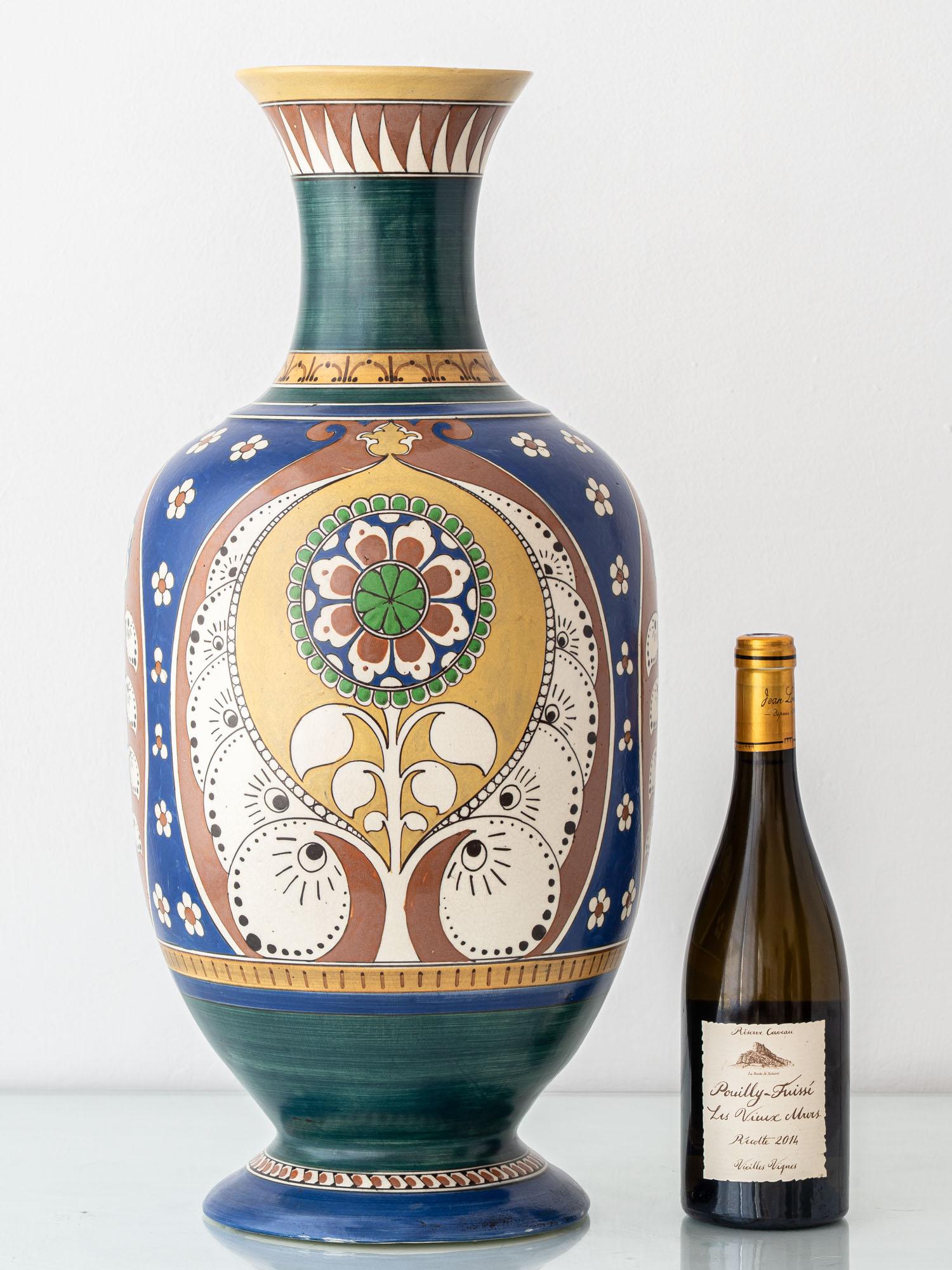 A rare and monumental vase made by Arnhemsche Fayencefabriek between 1910 and 1917. Bridging the final flourish of Dutch Art Nouveau (Nieuwe Kunst) and the emerging order of early Art Deco, this piece captures a pivotal moment in European ceramic