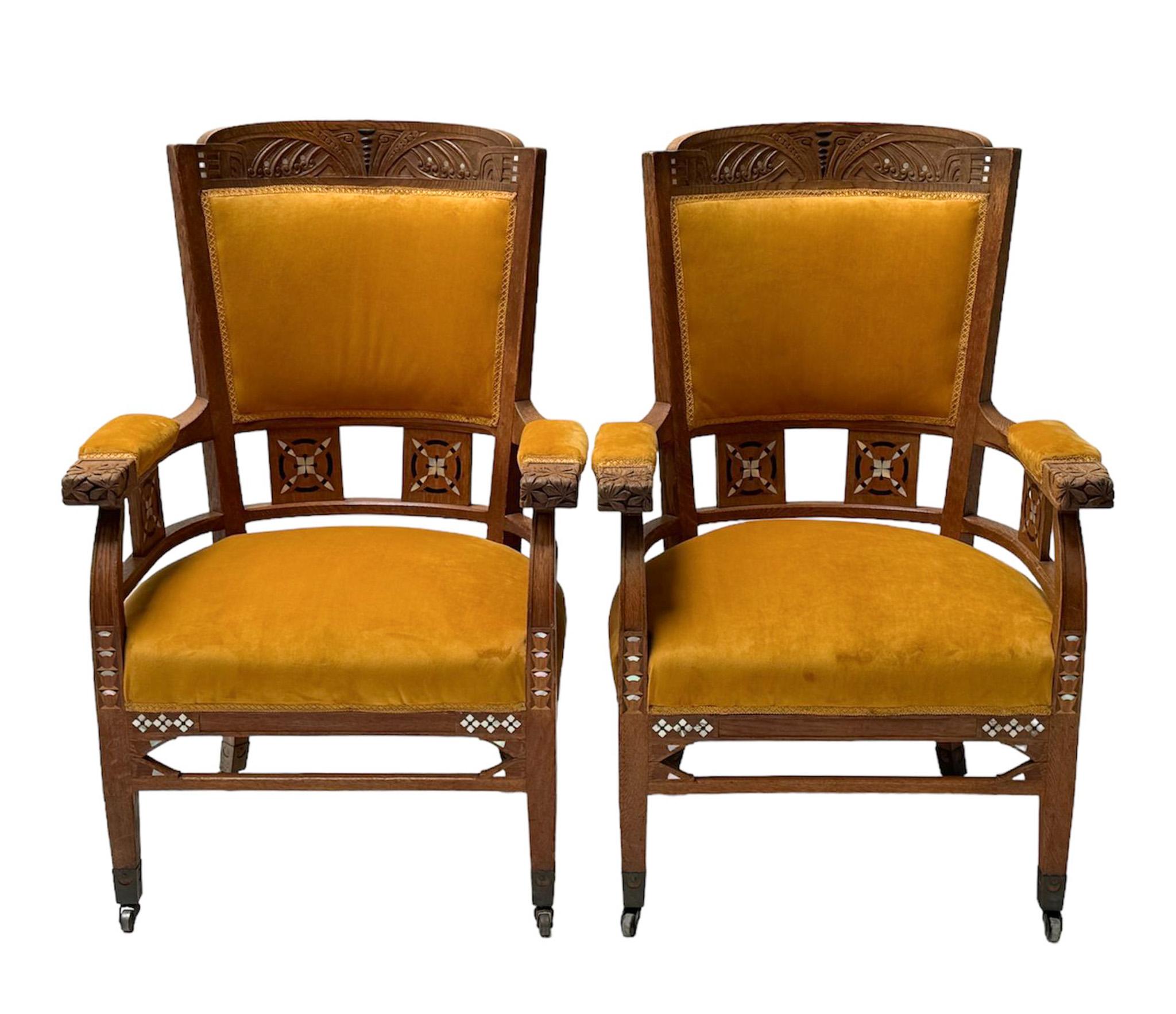 Magnificent and ultra rare pair of Art Nouveau Arts & Crafts armchairs.
Design by Royal H.F. Jansen & Zonen Amsterdam.
Striking Dutch design from the 1900s.
Solid oak frames with original hand-carved elements and inlay.
Re-upholstered with velvet