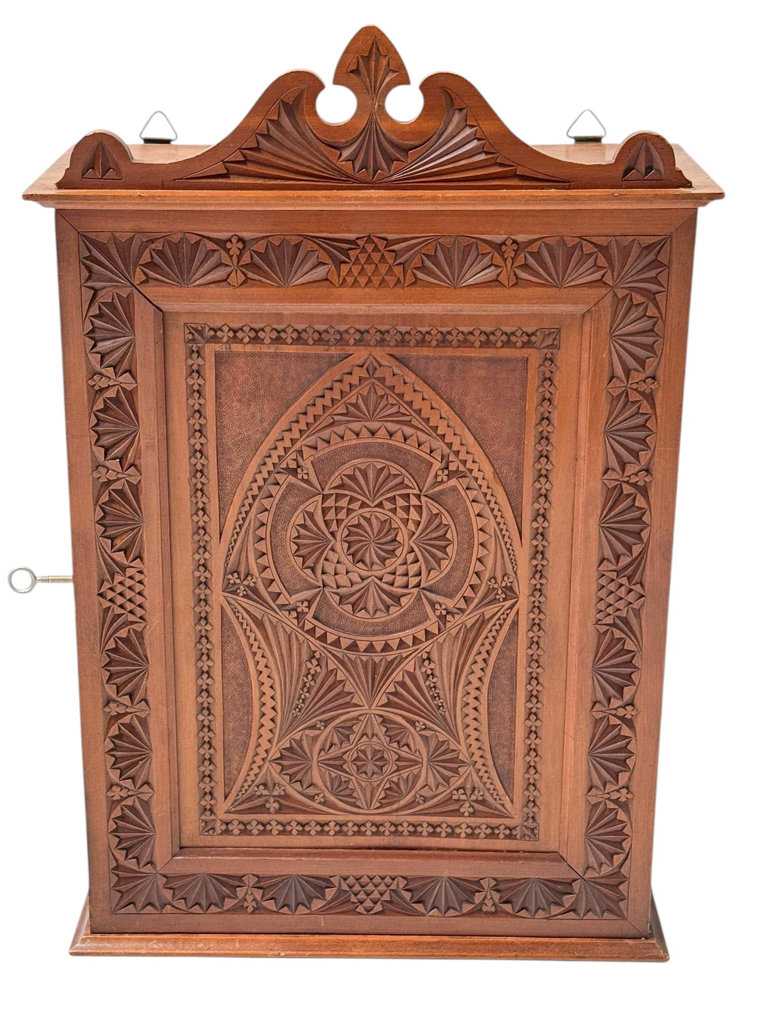 Magnificent and rare Arts & Crafts Art Nouveau wall cabinet.
Striking Dutch design from the 1900s.
Solid fruitwood base with original hand-carved so-called kerfschnitt decorative elements.
Lock and key are in good working order.
This wonderful Arts