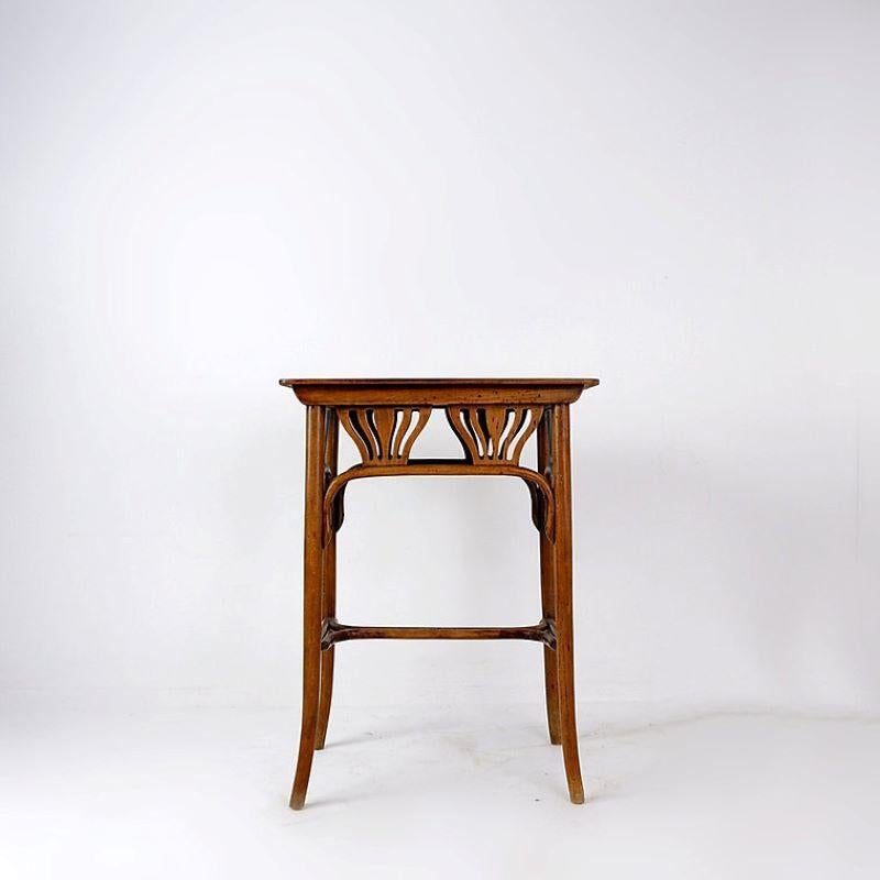 Circa 1916.
Wear consistent with age and use.

Austrian Bentwood Small, Rectangular Palm Side Table by Jacob & Josef Kohn

Such a timeless piece.
