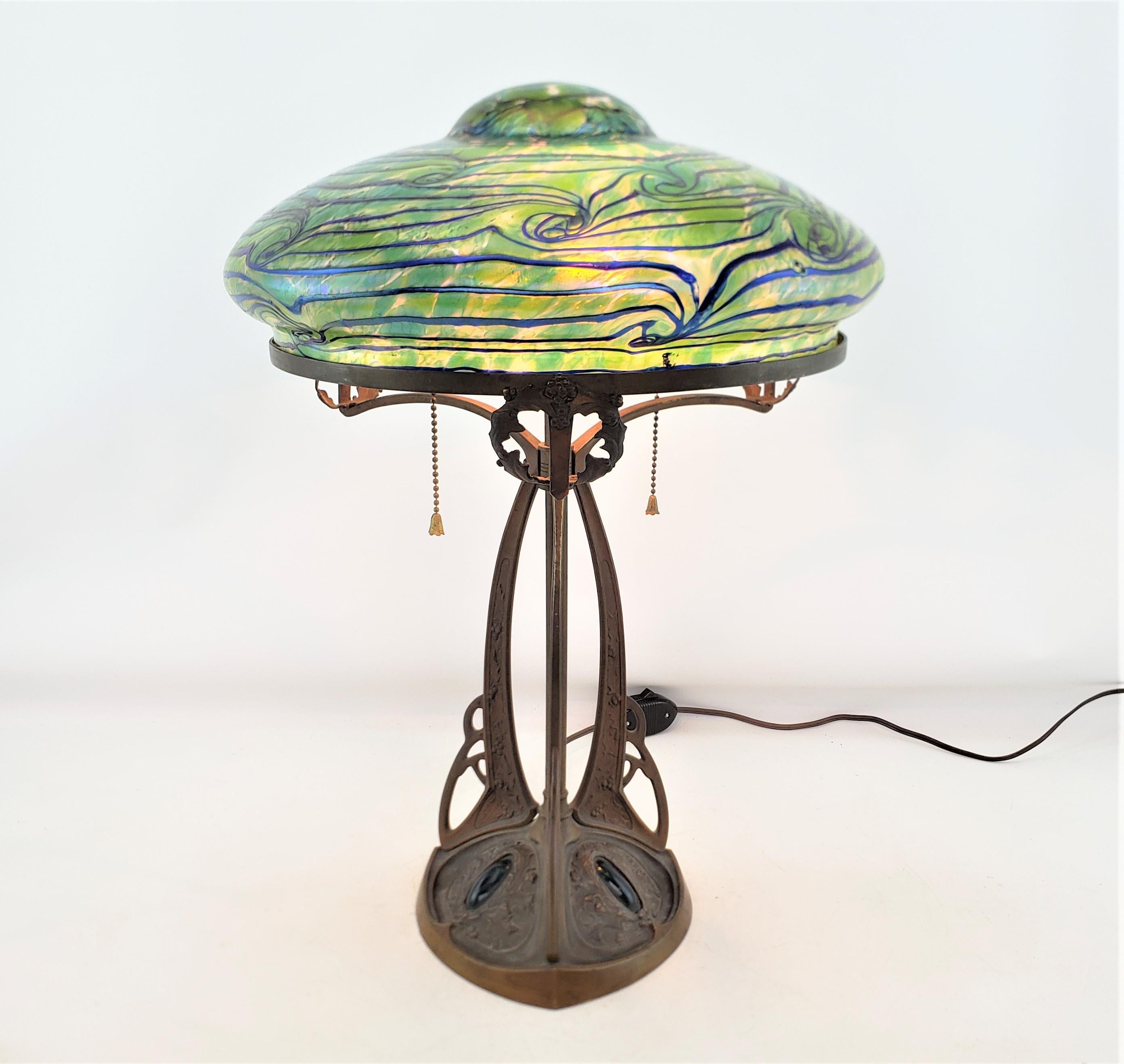 Cast Art Nouveau Austrian Bronze Table Lamp with Loetz Styled Art Glass Shade  For Sale