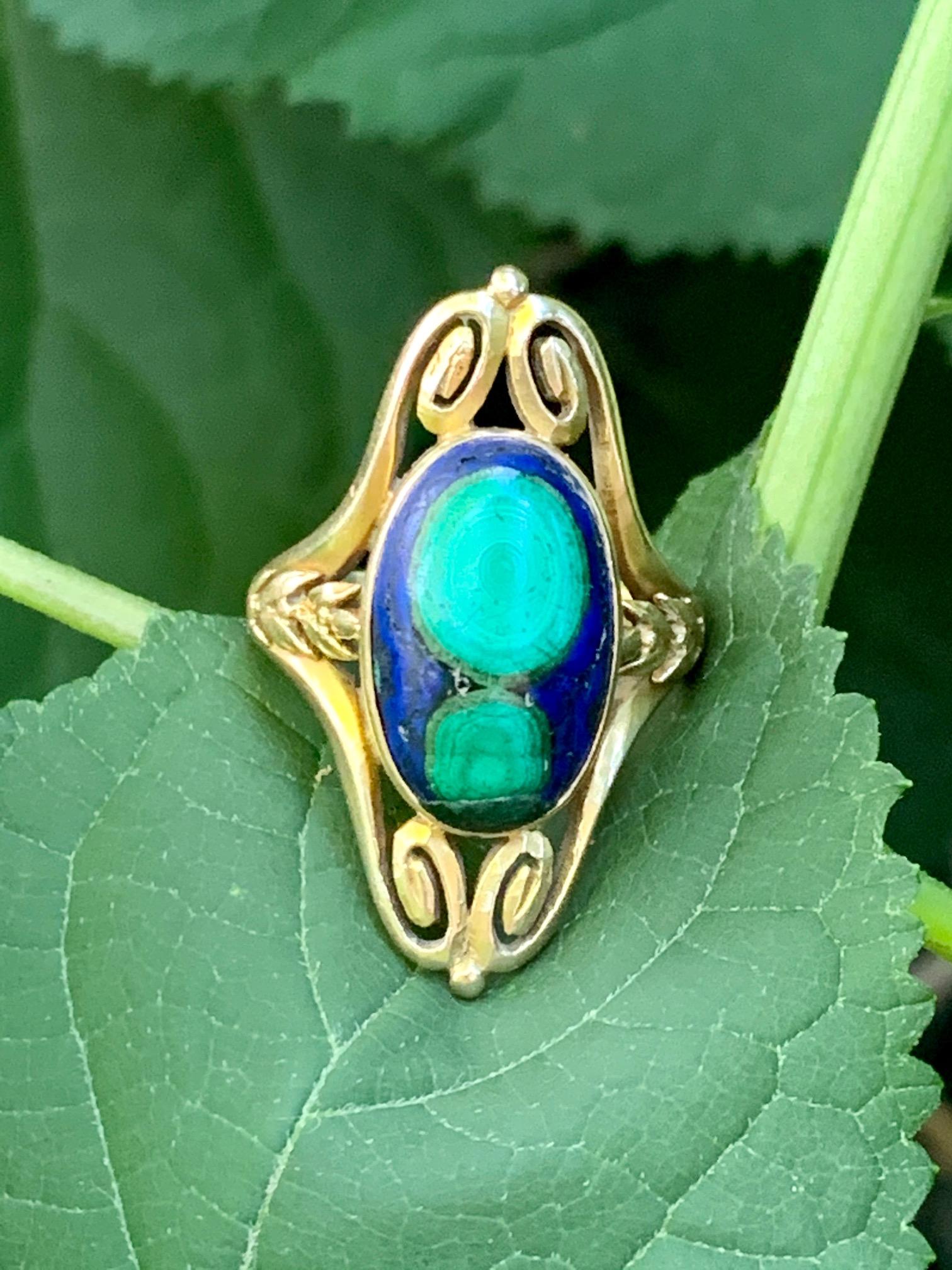 This Art Nouveau ring features an incredible Azurite Malachite Cabochon 16 x 11mm stone.   The stone does have some wear.

Size 6 3/4  - this ring is resizable but vendor does not offer sizing services. 
Weight; 7.69 grams