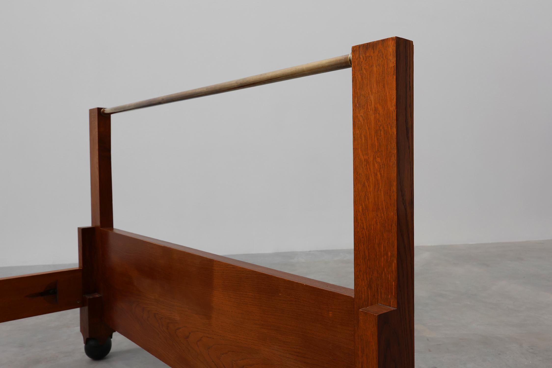 Belgium / 1905 / Bed / De Coene / oak, copper / Art Deco / Art Nouveau

Elegant en simplistic designed bed frame in solid oak wood with a bold copper bar at the head end most likely designed by De Coene Kortrijk. This small double bed has a pure and