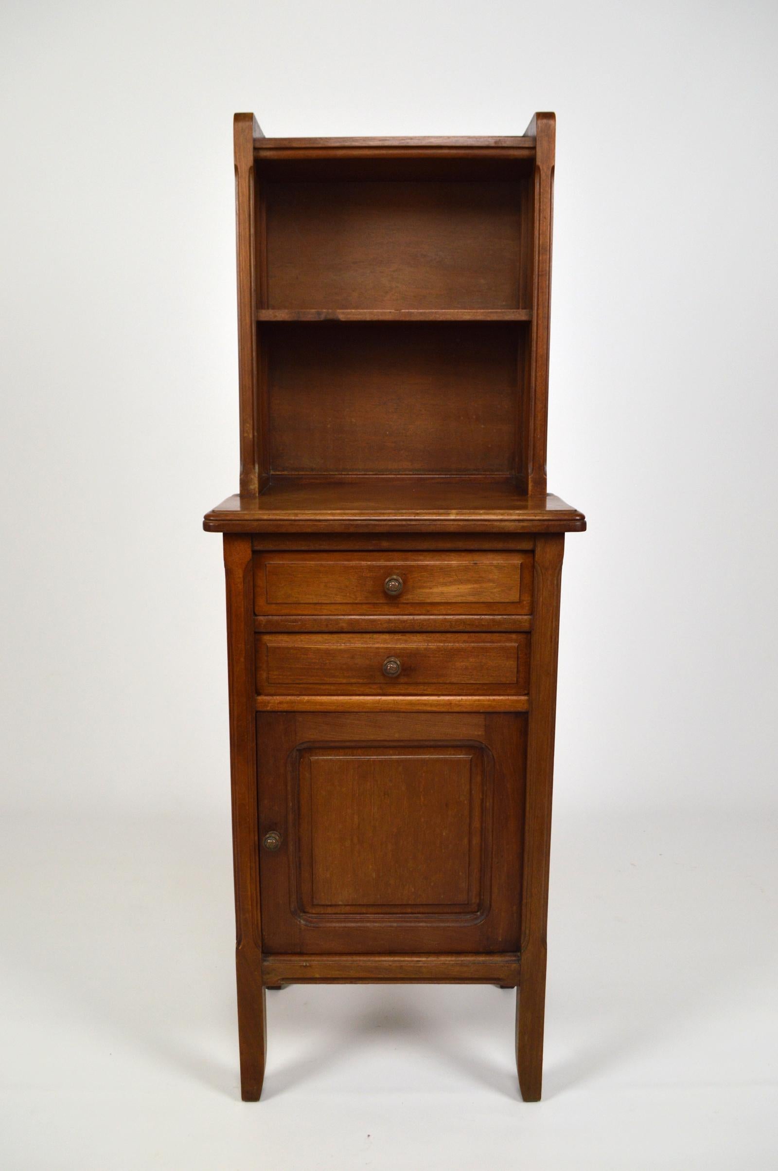 Pretty bedside table / nightstand in mahogany, composed of 2 shelves, 2 drawers and 1 porcelain-clad cupboard.
Bronze door knobs.

Art Nouveau, France, circa 1920.
By cabinetmaker Mathieu Gallerey (documentation + stamp present on other furniture