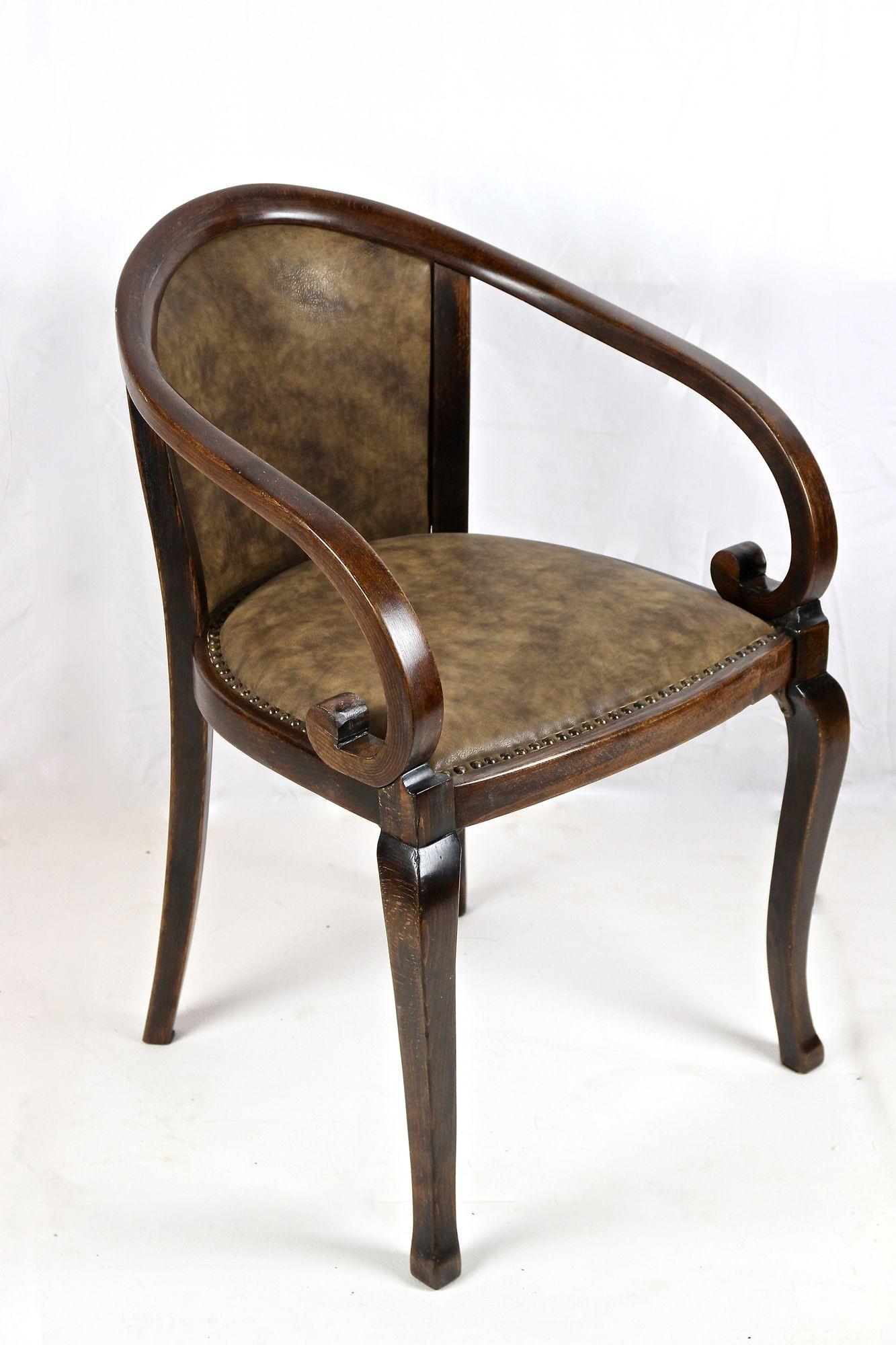 Unusual bentwood armchair produced by the famous company of Thonet at the end of the 19th century around 1895 in Vienna. This rare Austrian Art Nouveau armchair impresses with absoutely beautiful designed lines. The incredible looking armrests with