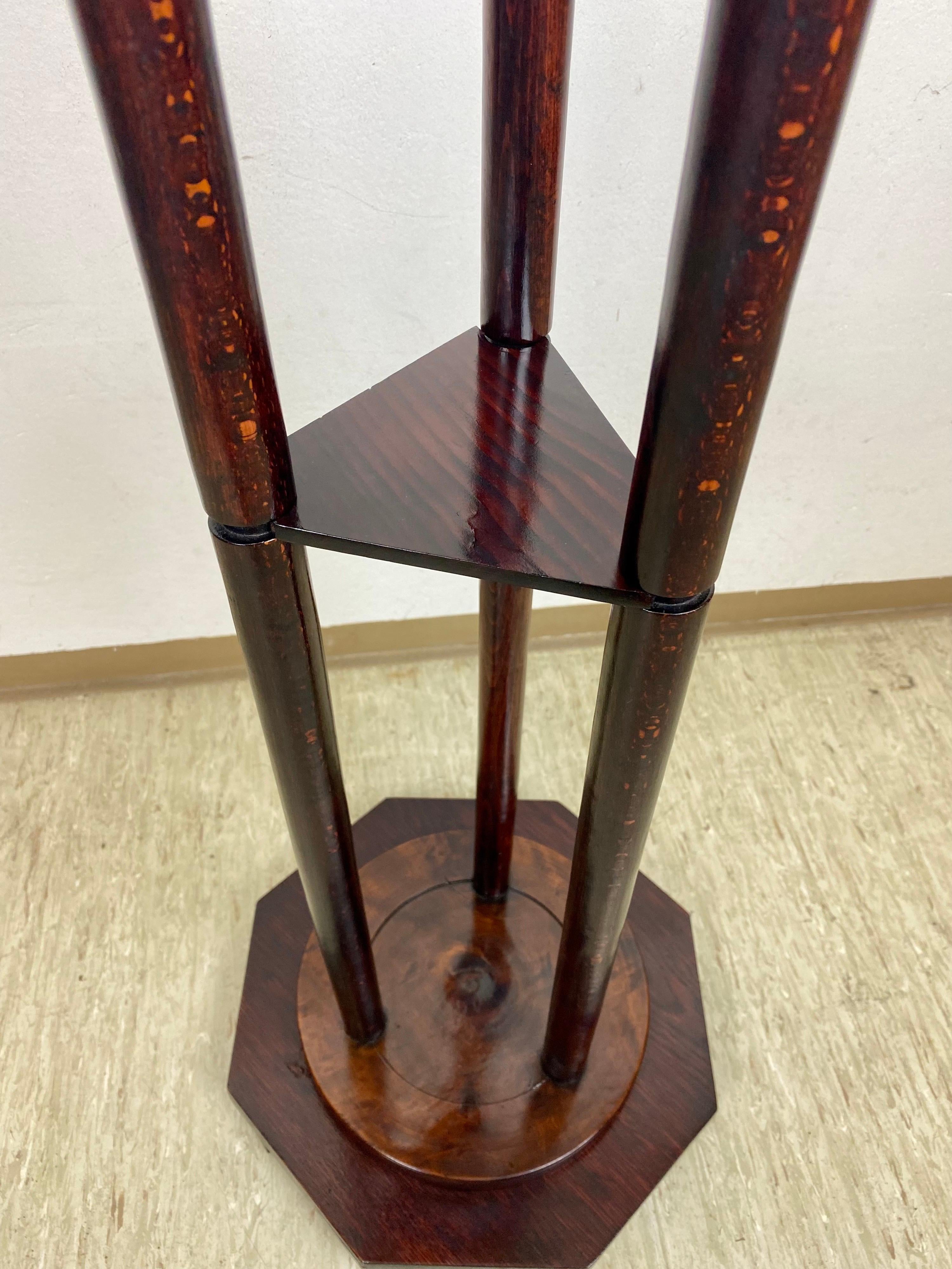 Lovely Art Nouveau Bentwood Pedestal from the period in Austria around 1900. Beautifully made of bentwood, this unique pedestal impresses with three slim columns on an octagon base. In the middle floats a small triangular compartment. The whole