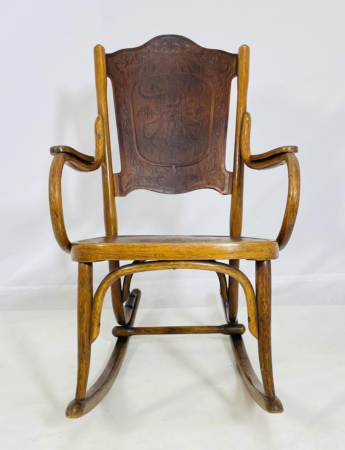 A graceful and historically significant bentwood rocking chair by renowned Viennese furniture makers Jacob & Josef Kohn, dating to circa 1900. Crafted in Austria, this sculptural piece is a hallmark of the Art Nouveau movement, featuring flowing