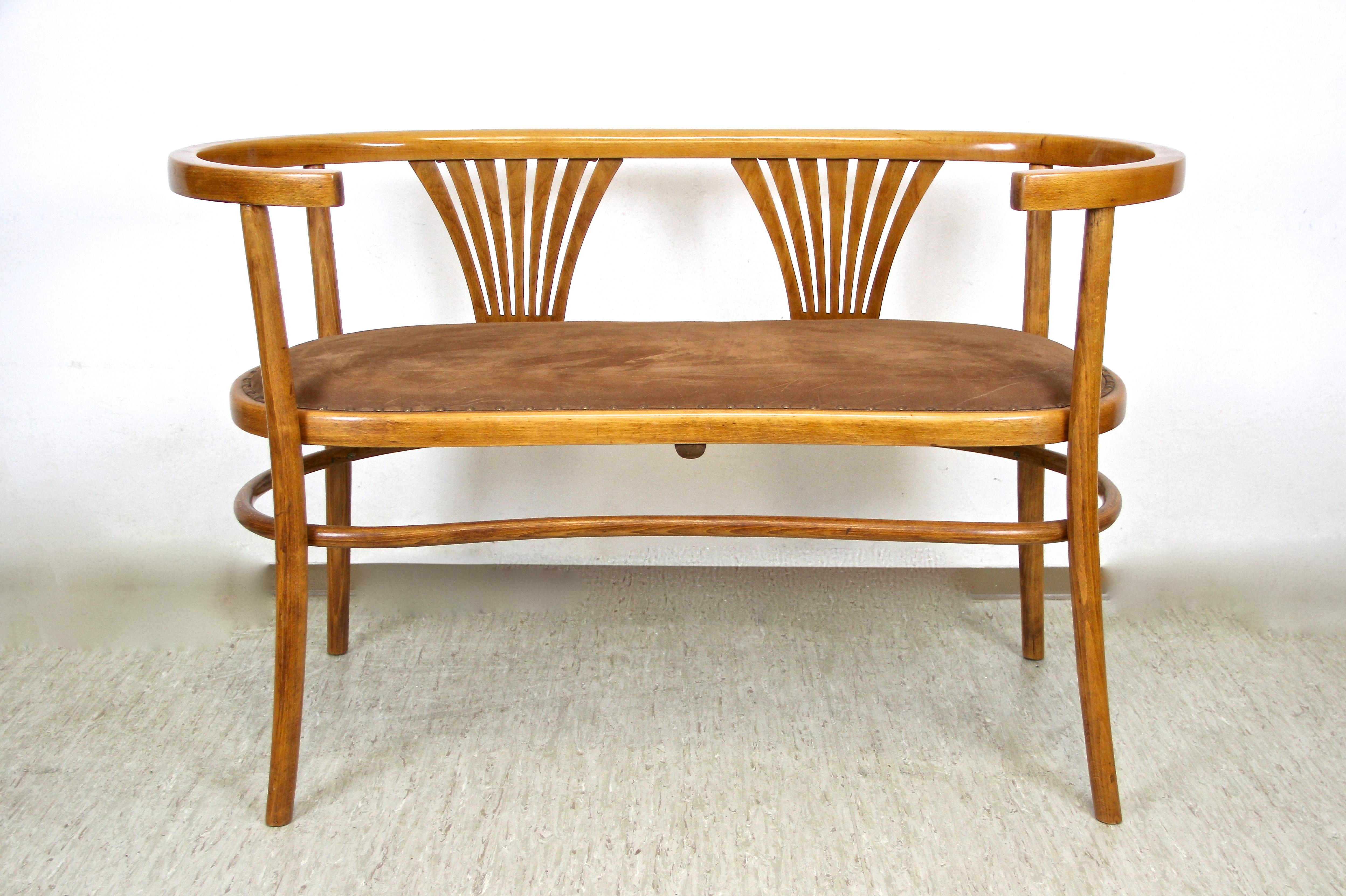 Unusual bentwood seating set artfully processed by the Czechoslovakian bentwood manufactory of Brief, circa 1910. The exceptional shaped bench as well as the two armchairs were made of beechwood that was bent under steam and high pressure. All items