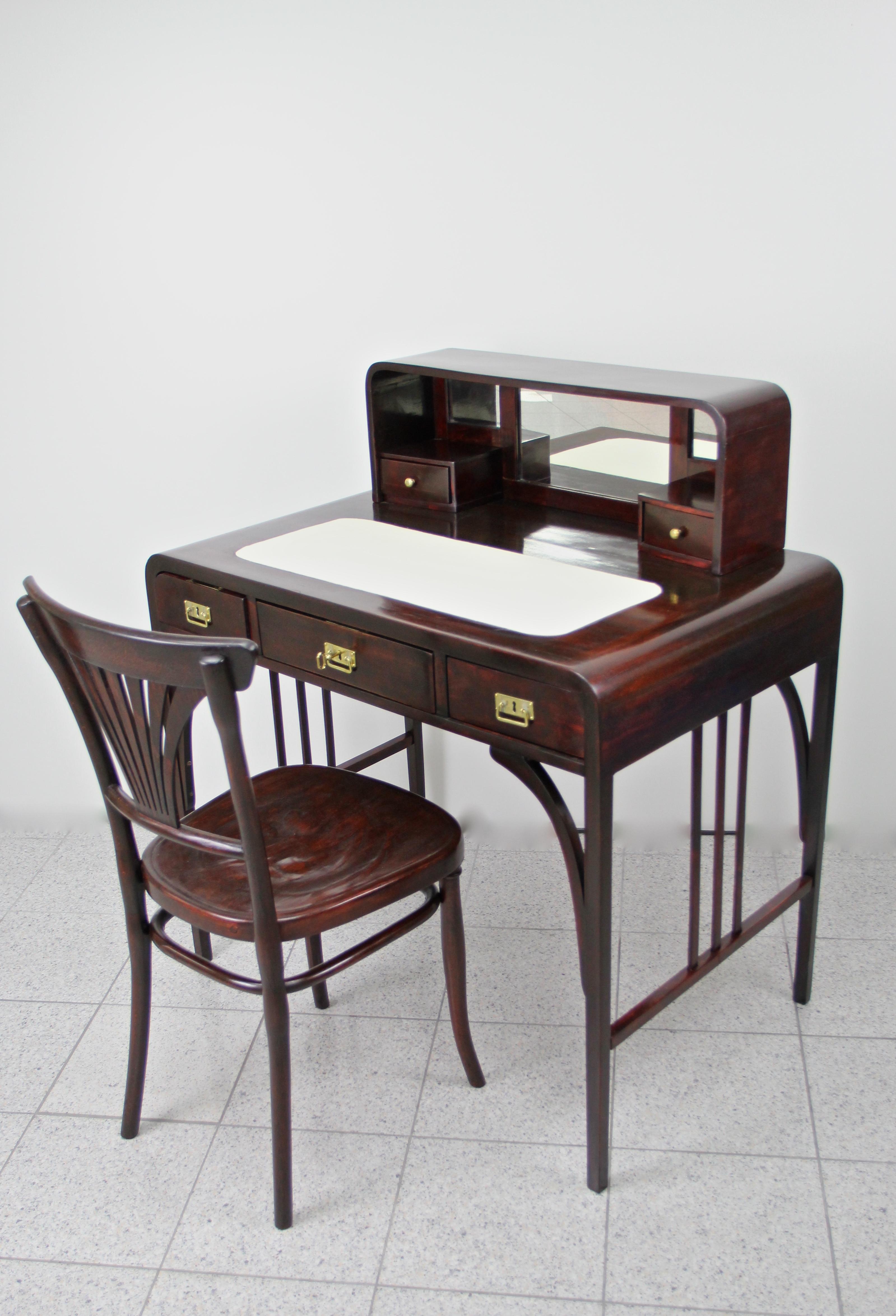 Remarkable Art Nouveau bentwood writing table or desk from circa 1910 in Austria, attributed to Thonet. Made of fine bentwood and trimmed to mahogany, this fantastic writing desk is an absolute masterpiece of design. Incredible shaped lines, rounded