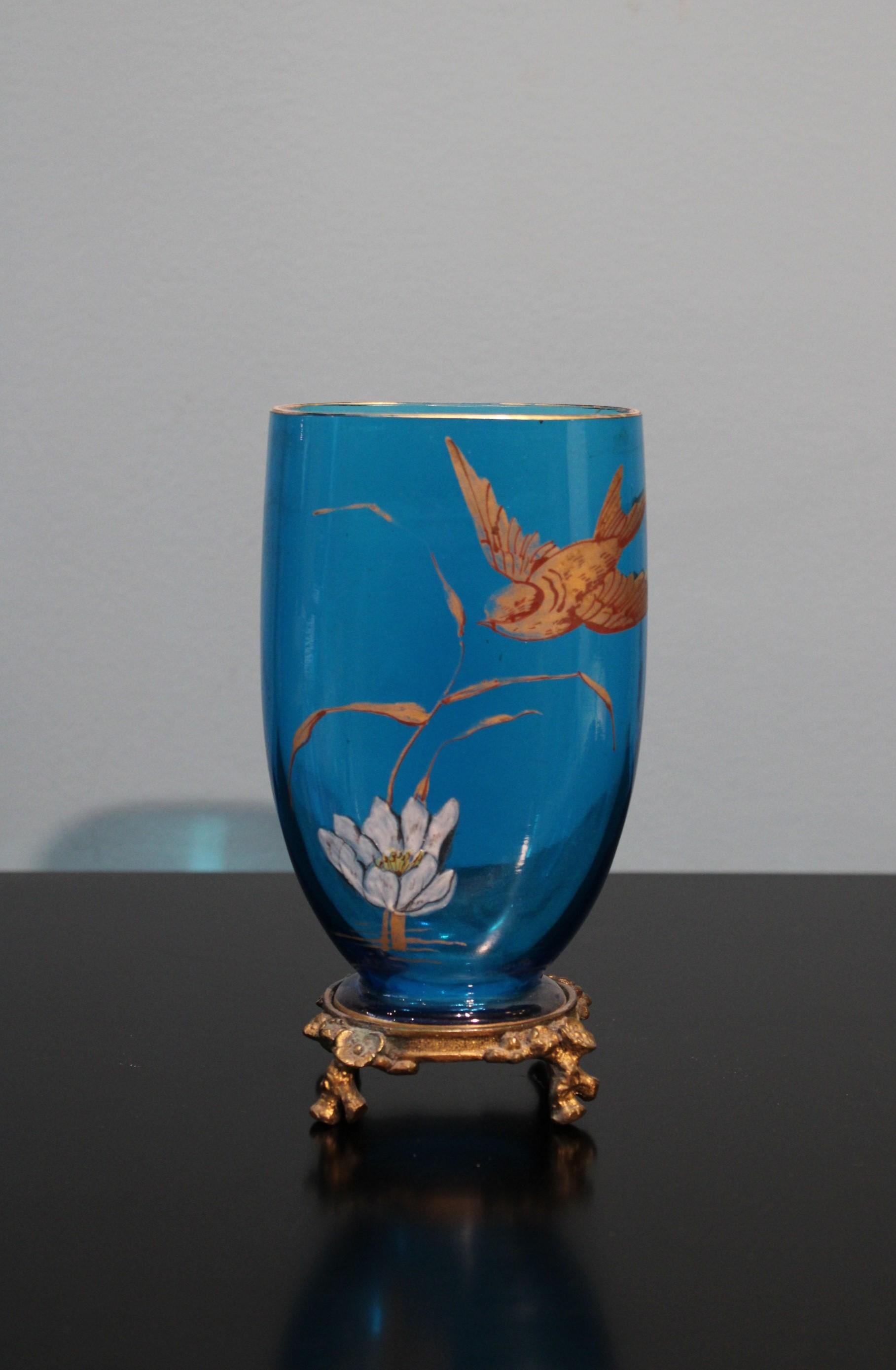 Vase in glass, on a sculpted metal mount 
Blue color. Flower and bird decor.
Art nouveau style, circa 1900.
 