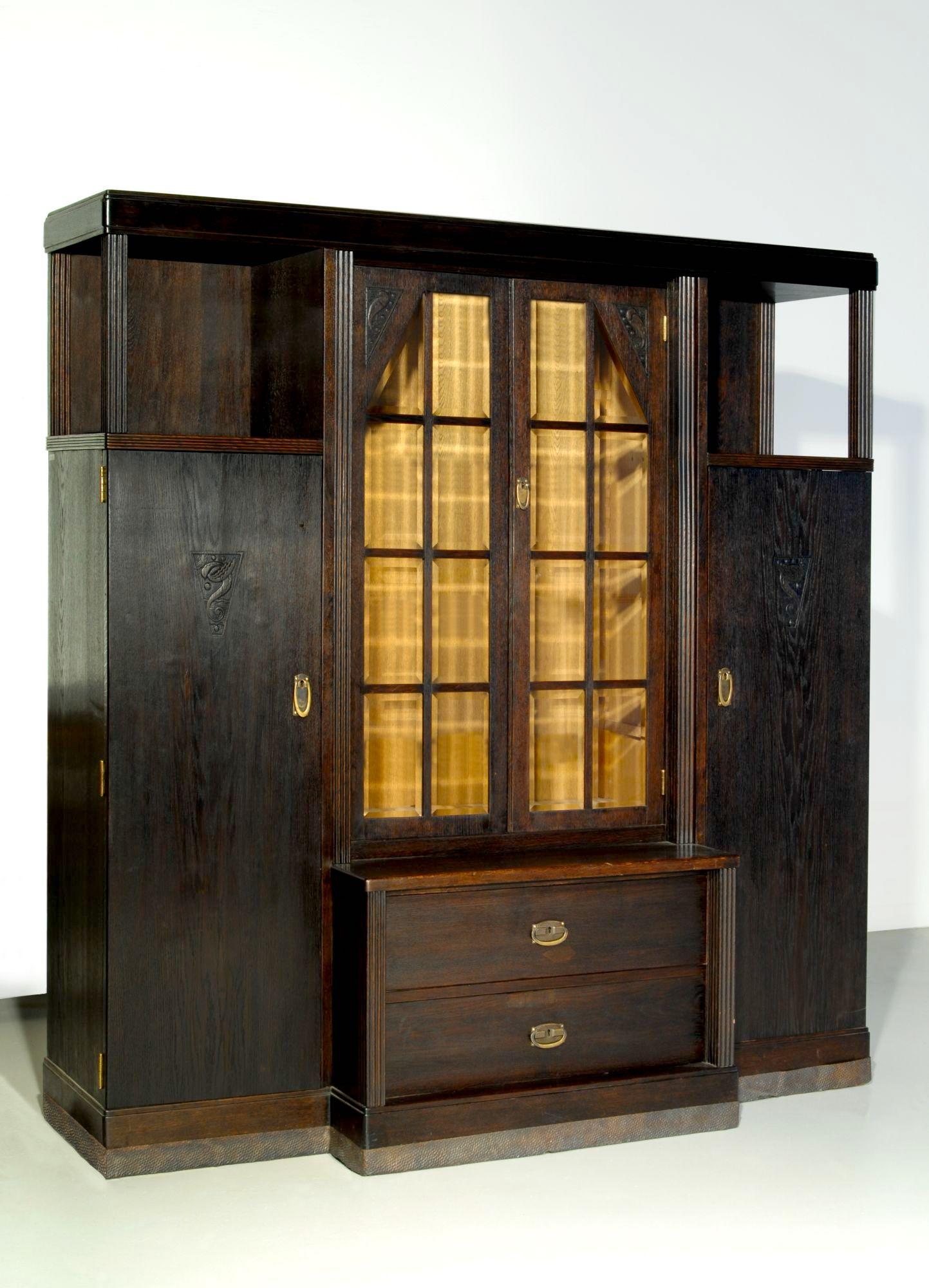Austro-Hungarian Wiener Werkstätte period bookcase , made around 1905, attributed to Koós Károly (Hungarian architect and designer), decorated with hand carved elements, such as birds and river. Made of polished oak, hand hammered red copper ,