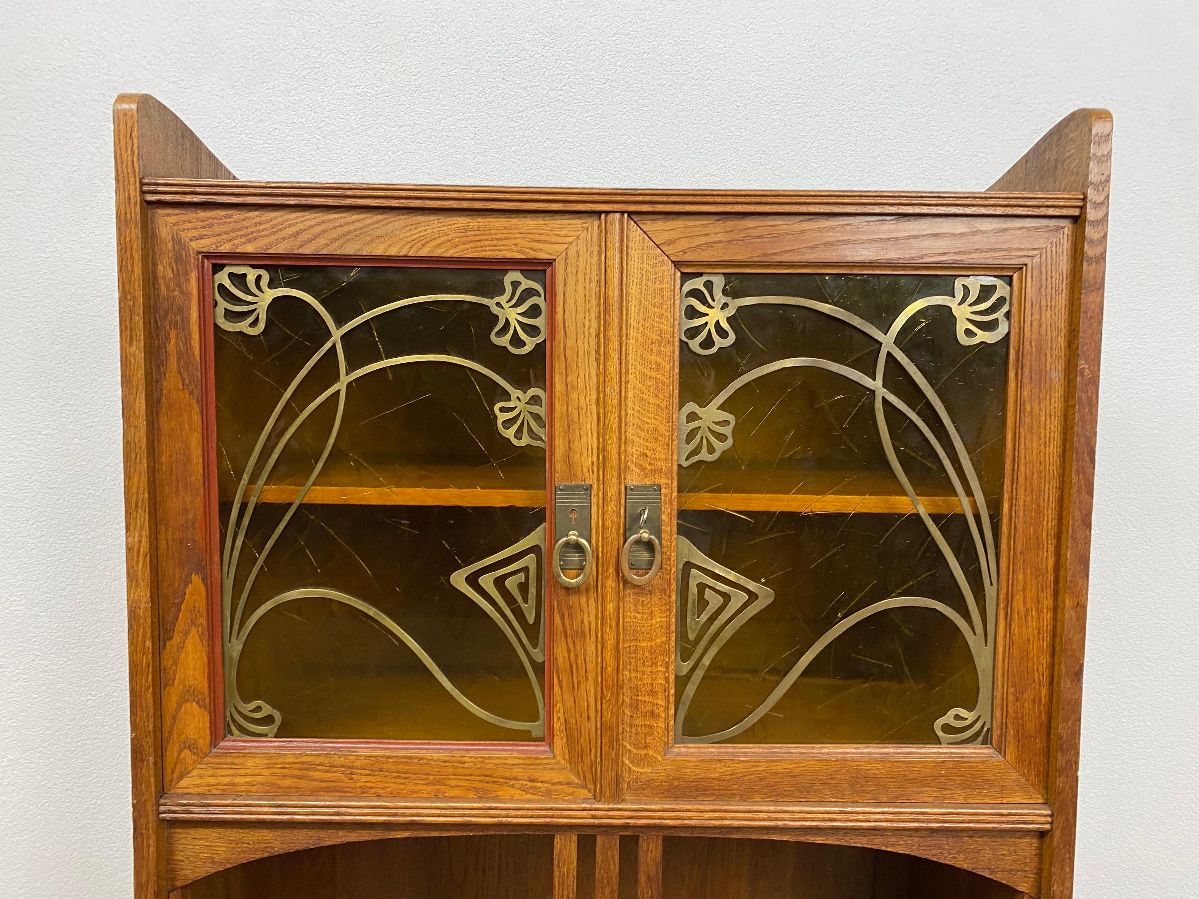 Art nouveau bookcase with brass fittings in excellent original condition.