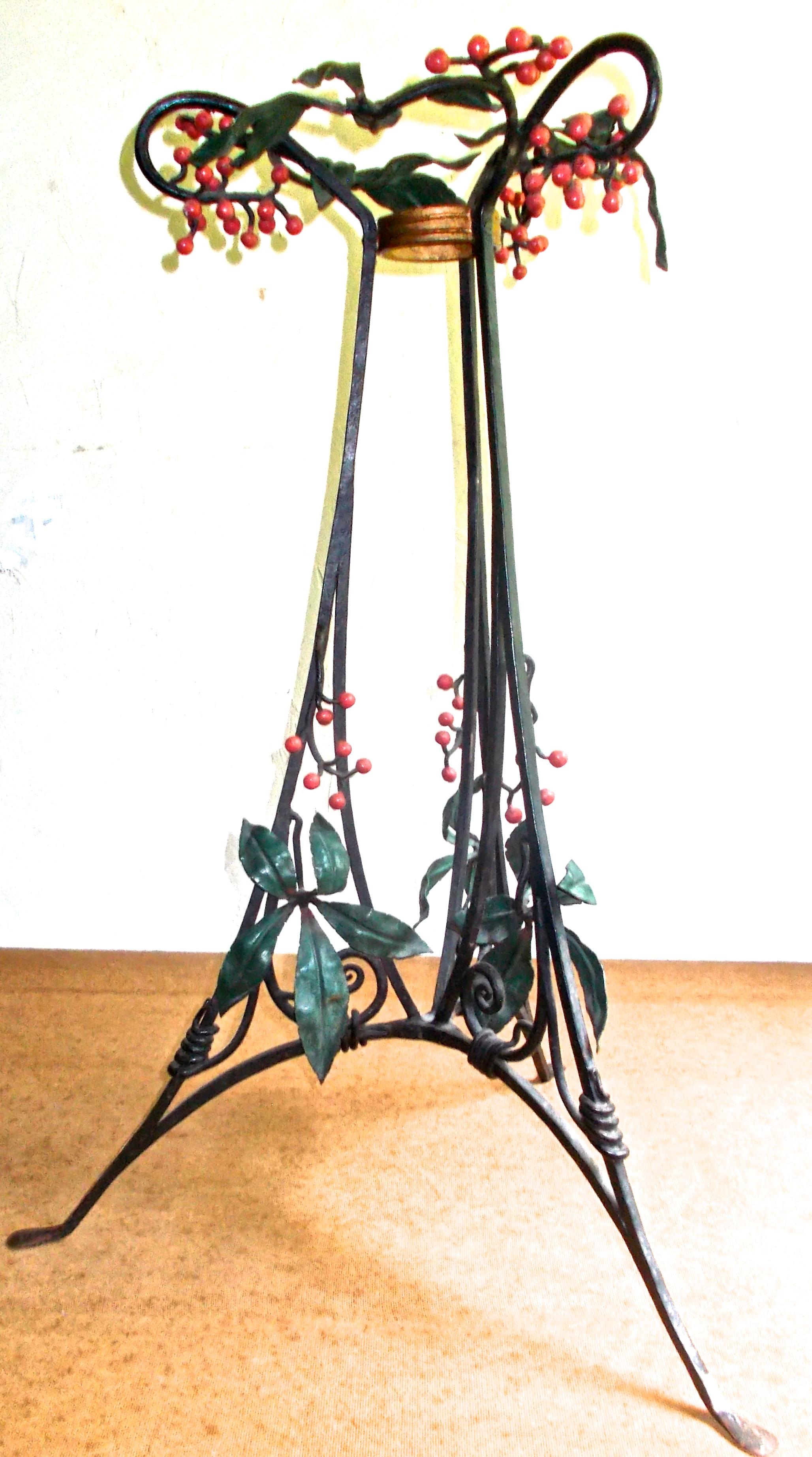 A delicate wrought iron pedestal, original paint on leaves and berries.