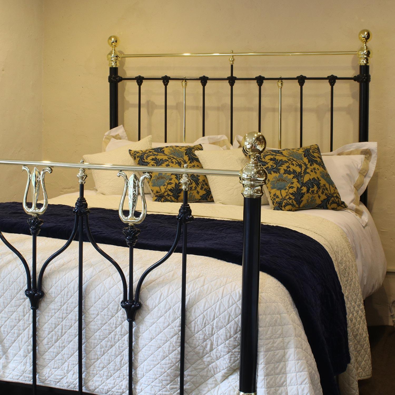 A superb brass and iron bedstead with Art Nouveau brass castings, finished in black.

This bed accepts a British king-size or US queen-size (measure: 5ft, 60 in or 150cm wide) base and mattress set.

The price is for the bed frame alone. The