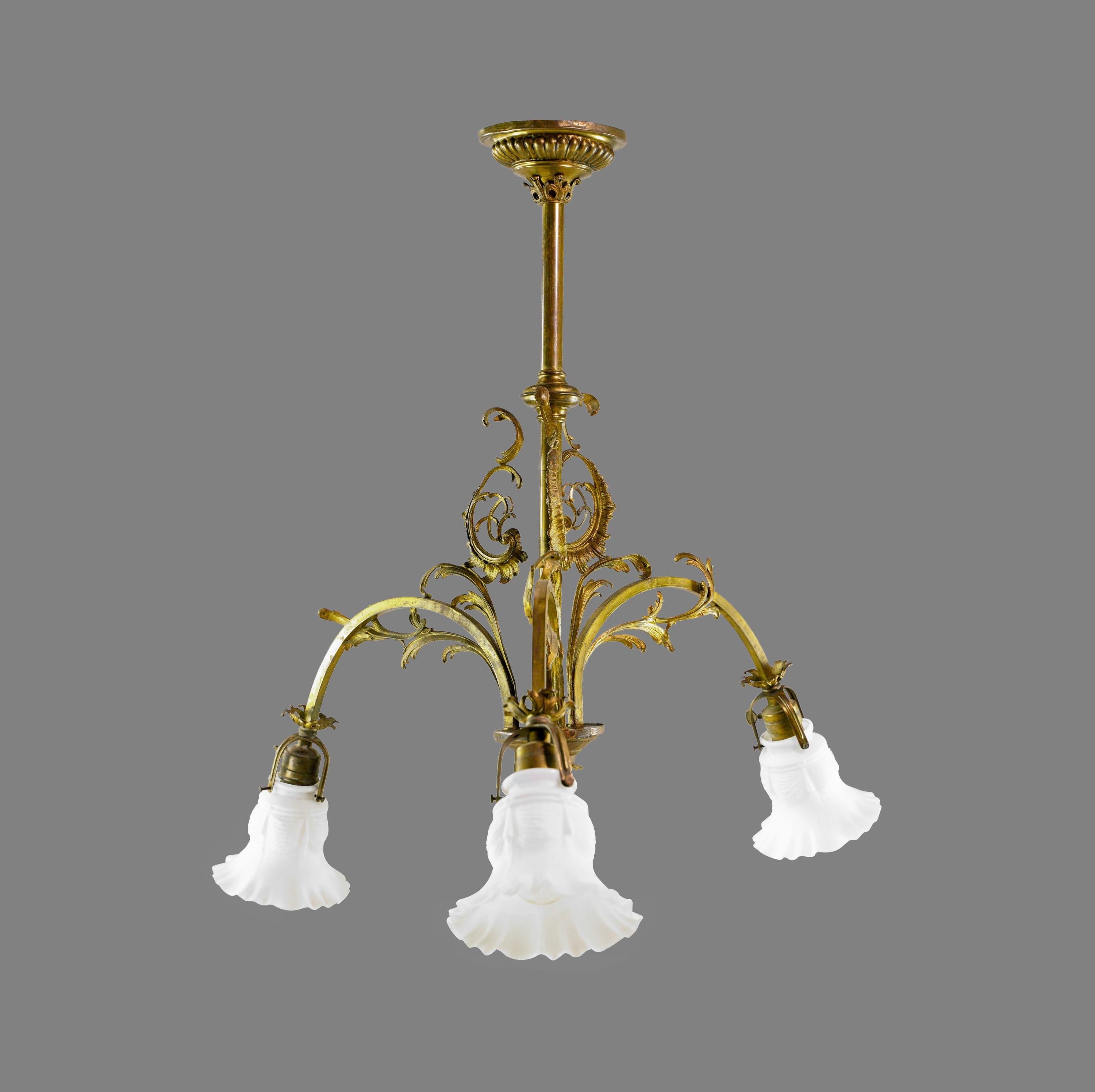 Art Nouveau brass down light chandelier with three ruffled glass shades. This chandelier has three standard sockets. Cleaned and restored. Minor dents on the canopy and bends on the bottom. Please note, this item is located in our Scranton, PA