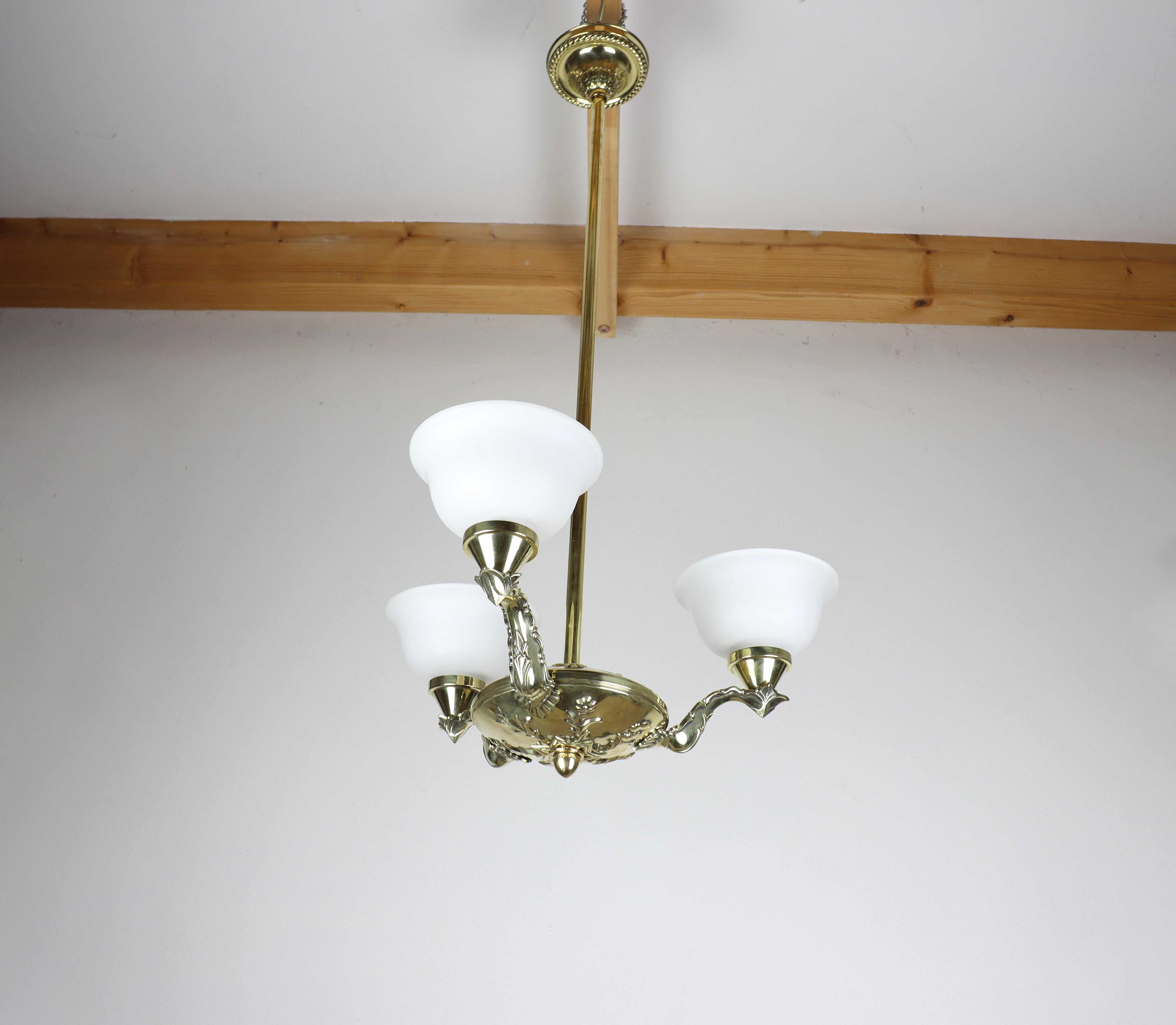 Early 20th Century Art Nouveau Brass Chandelier with Embossed Elements For Sale