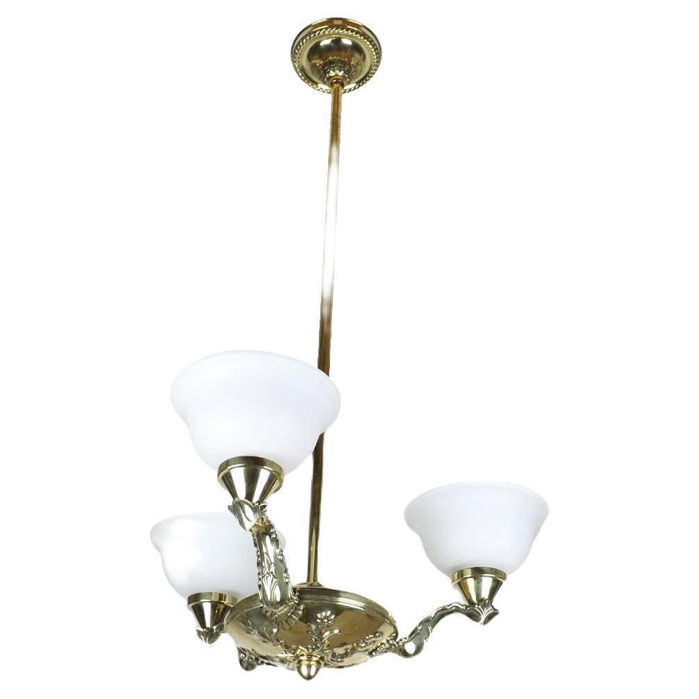 Art Nouveau Brass Chandelier with Embossed Elements For Sale