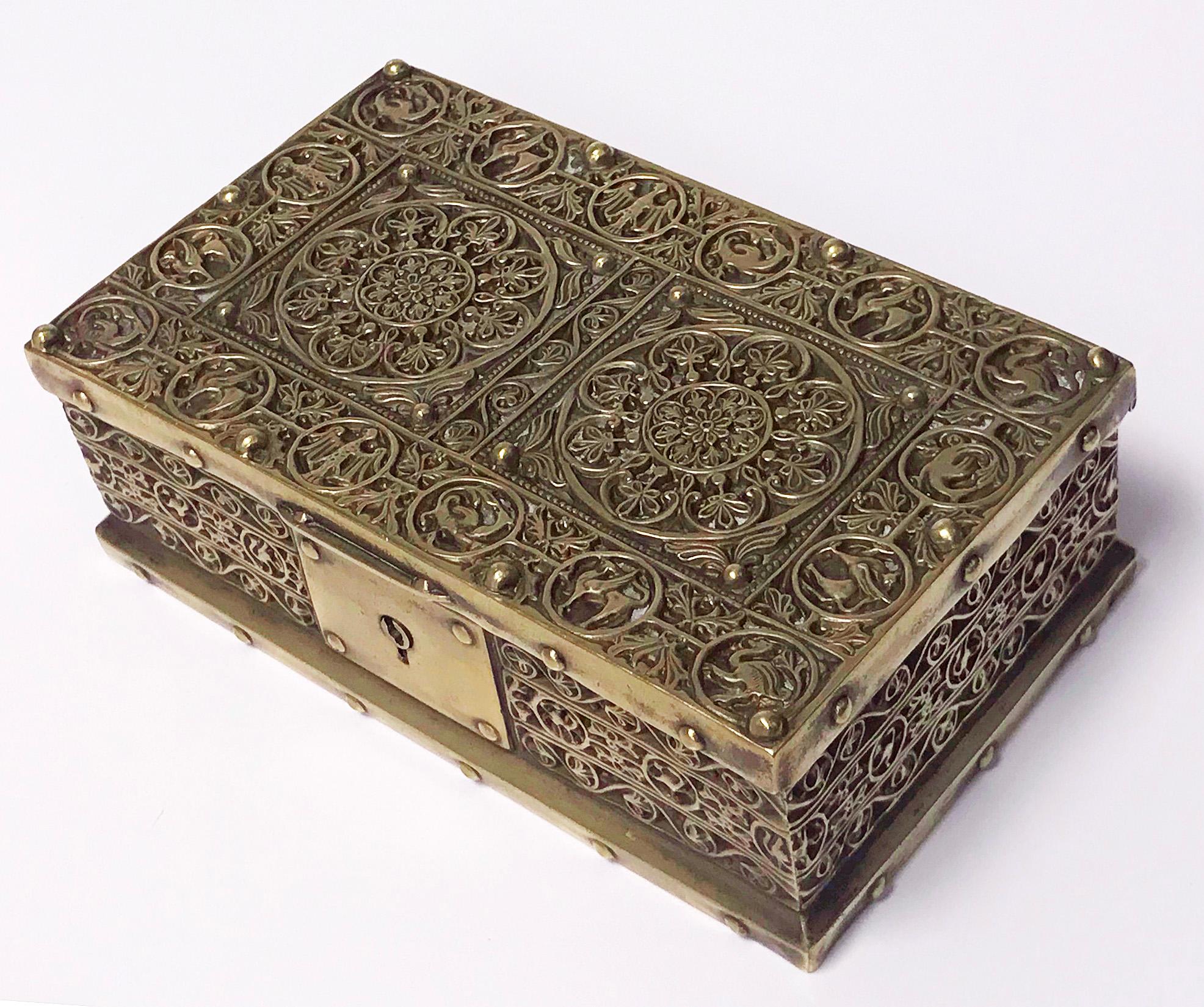 Brass jewelry box, Germany circa 1920 probably Erhard & Söhne of Schwäbisch Gmünd. The box of rectangular shape, the brass body and cover oxidized inlay classic art nouveau arabesque decoration featuring panels with images of mythological creatures