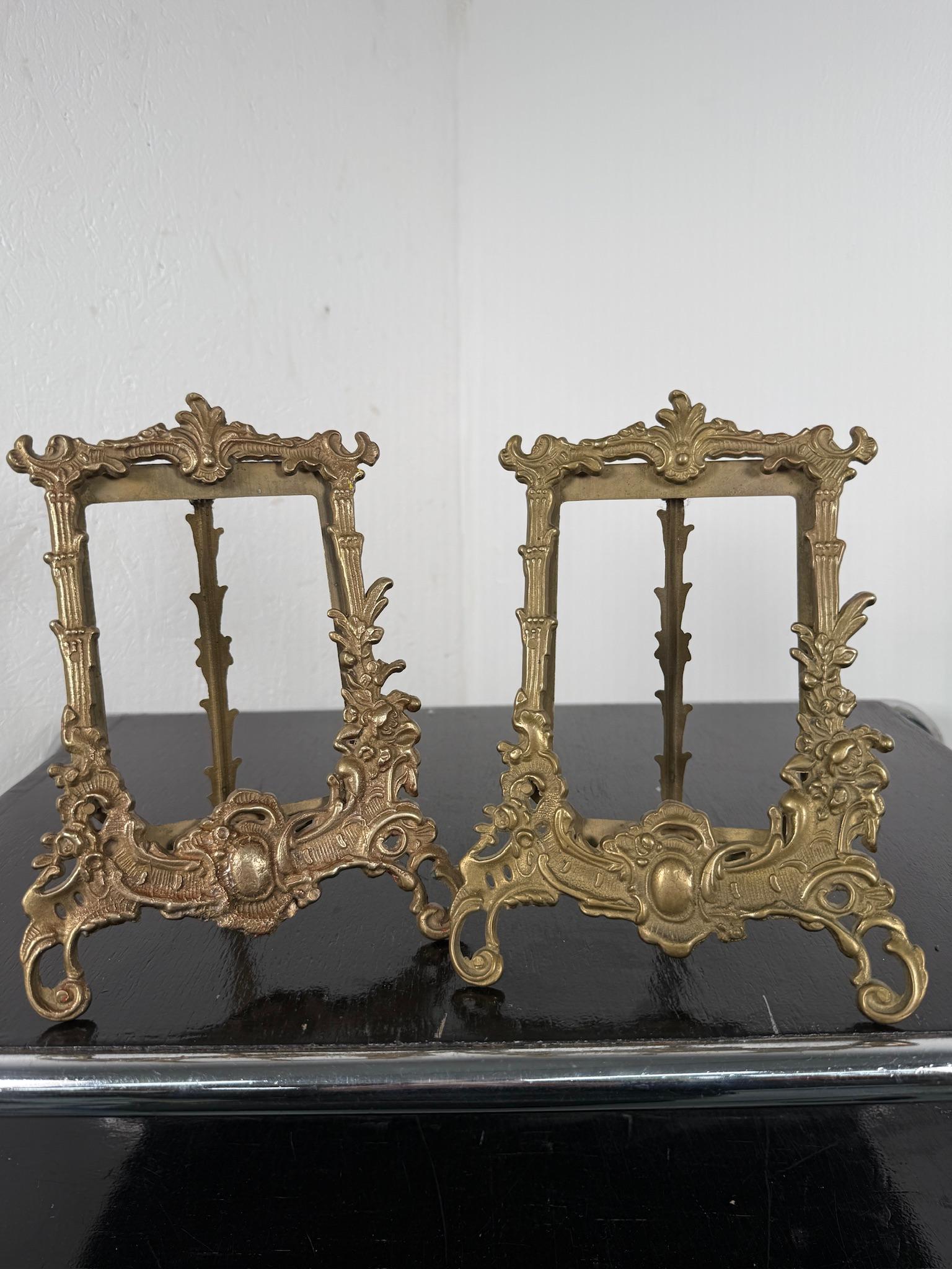These elegant Art Nouveau brass photo frames are a beautiful example of early 20th-century craftsmanship. Characterized by its flowing organic lines, intricate floral motifs, and delicate curves, this frame embodies the essence of the Art Nouveau