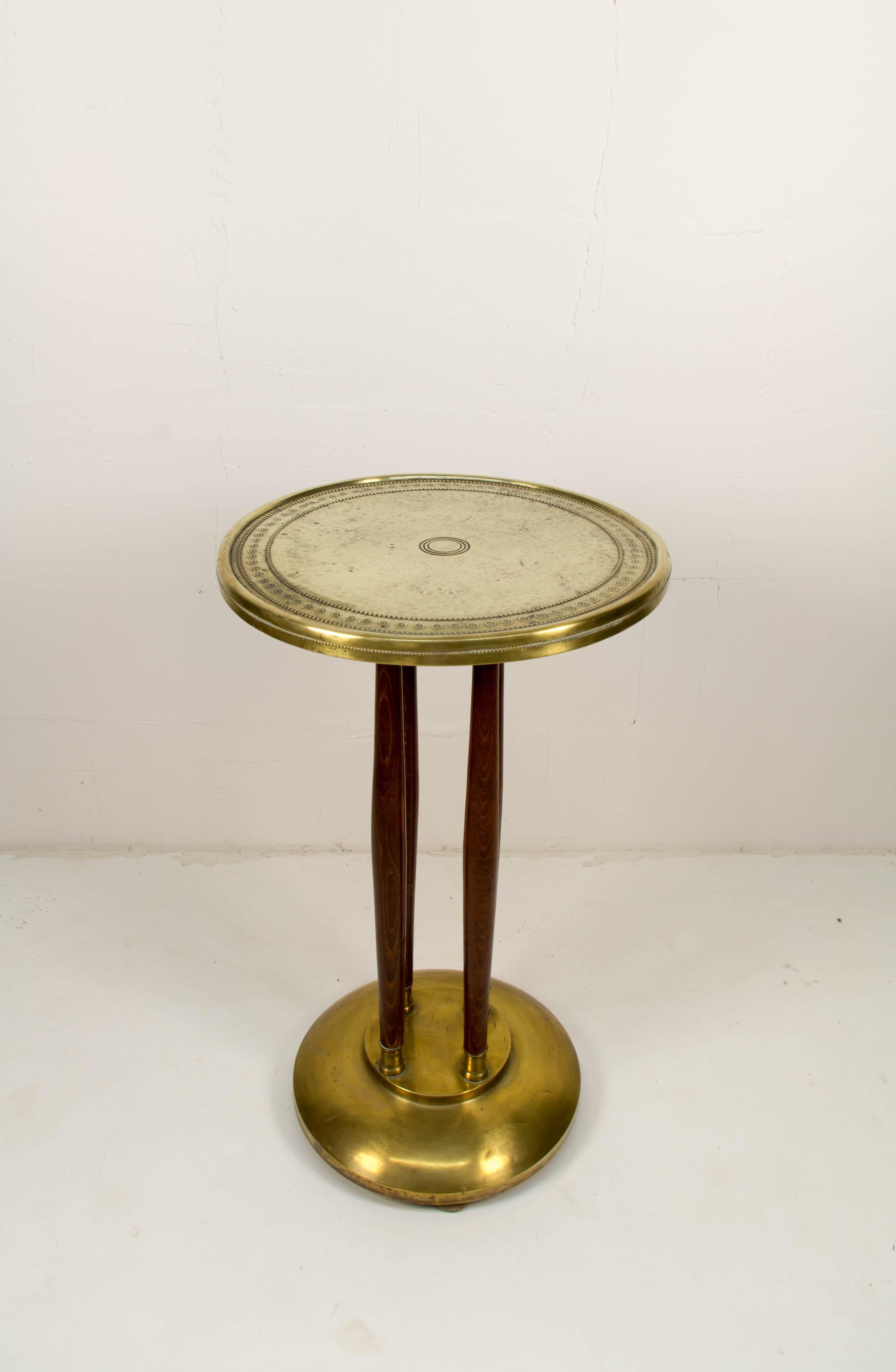 A four wood legs Art Nouveau smoker's table with brass base and top desk. Could be used as pedestal or flower table. Refurbished.