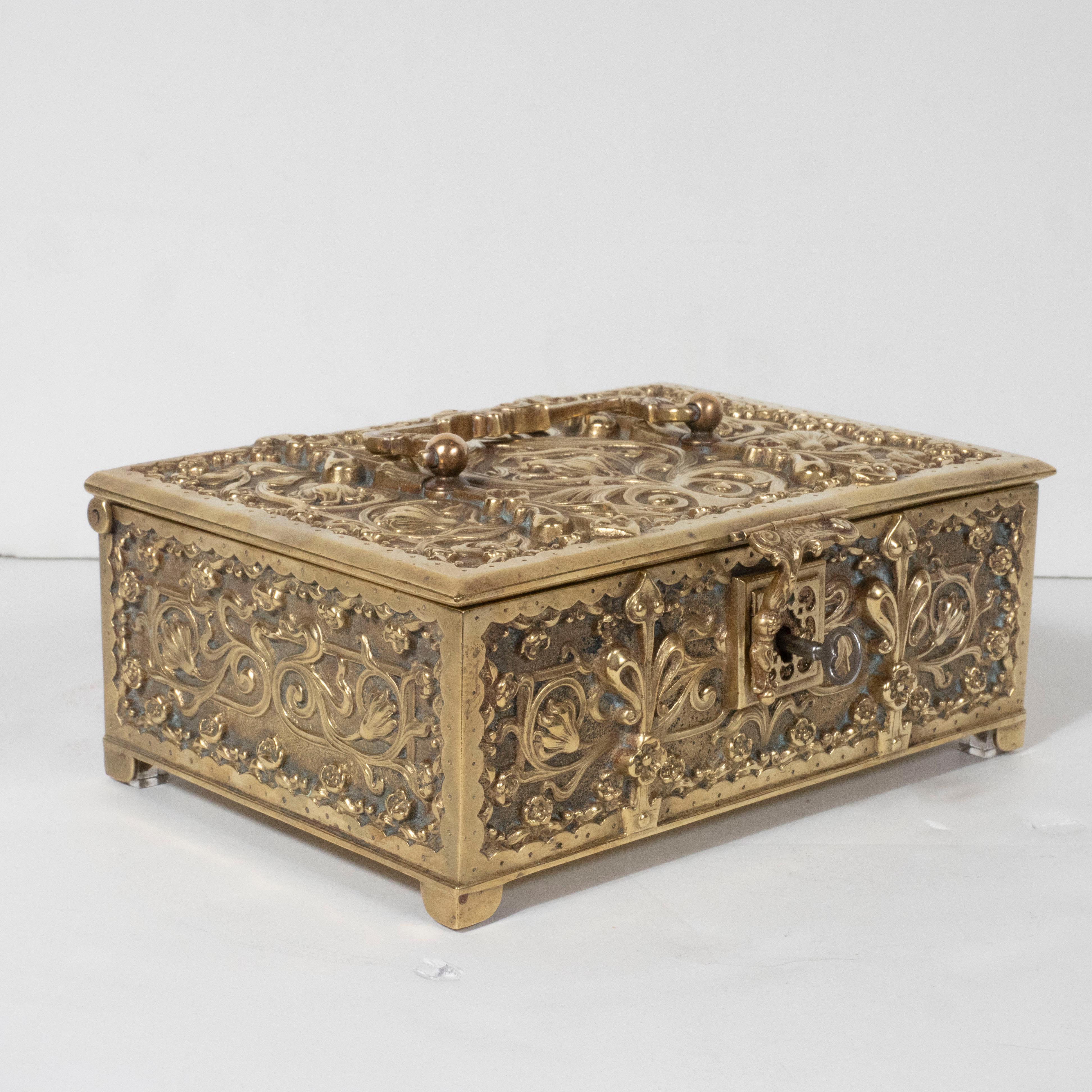 Early 20th Century Art Nouveau Brass Repoussé Box with Stylized Fleur-de-Lis and Foliate Motifs