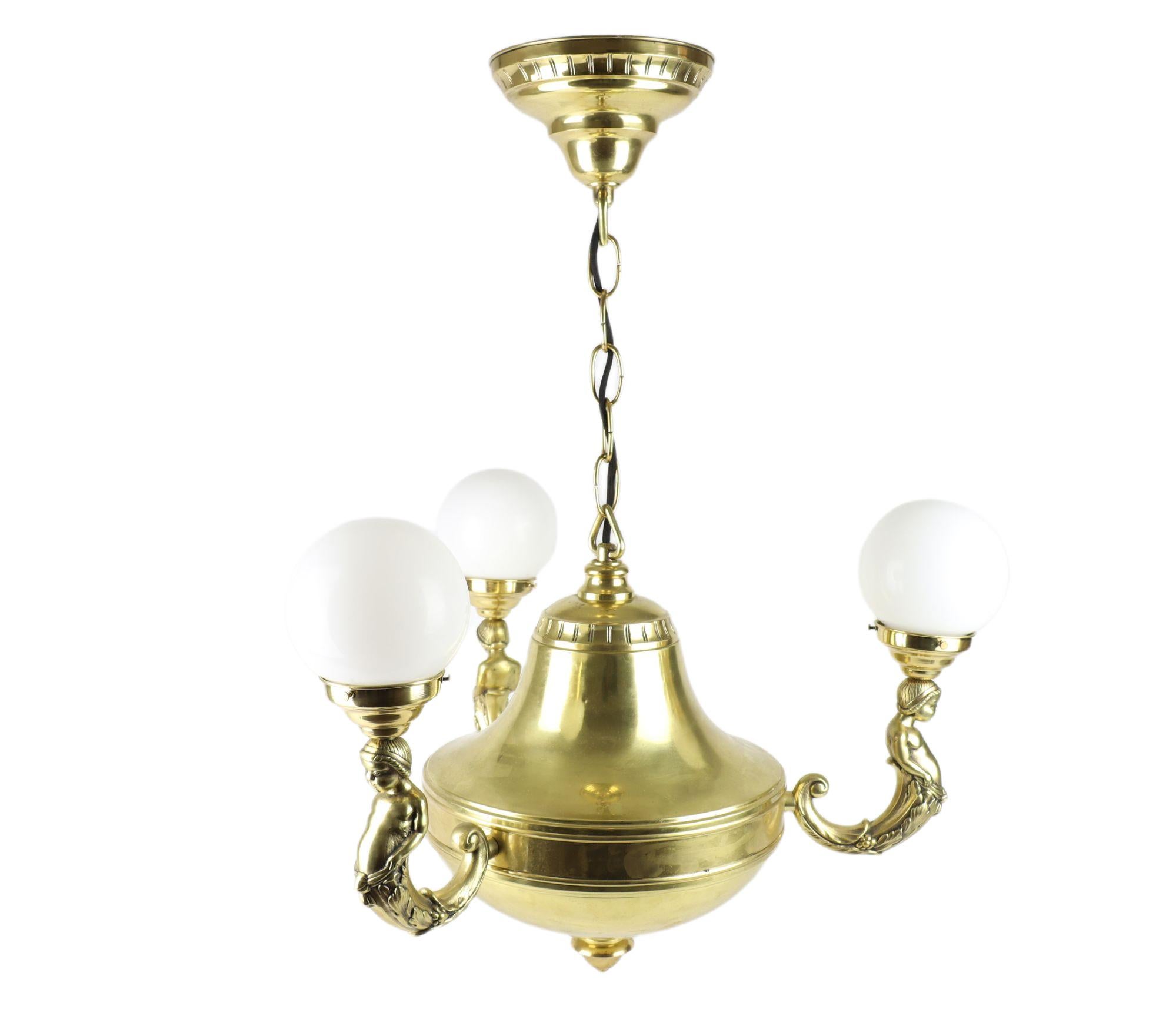 Czech Art Nouveau Brass Representative Figural Chandelier For Sale