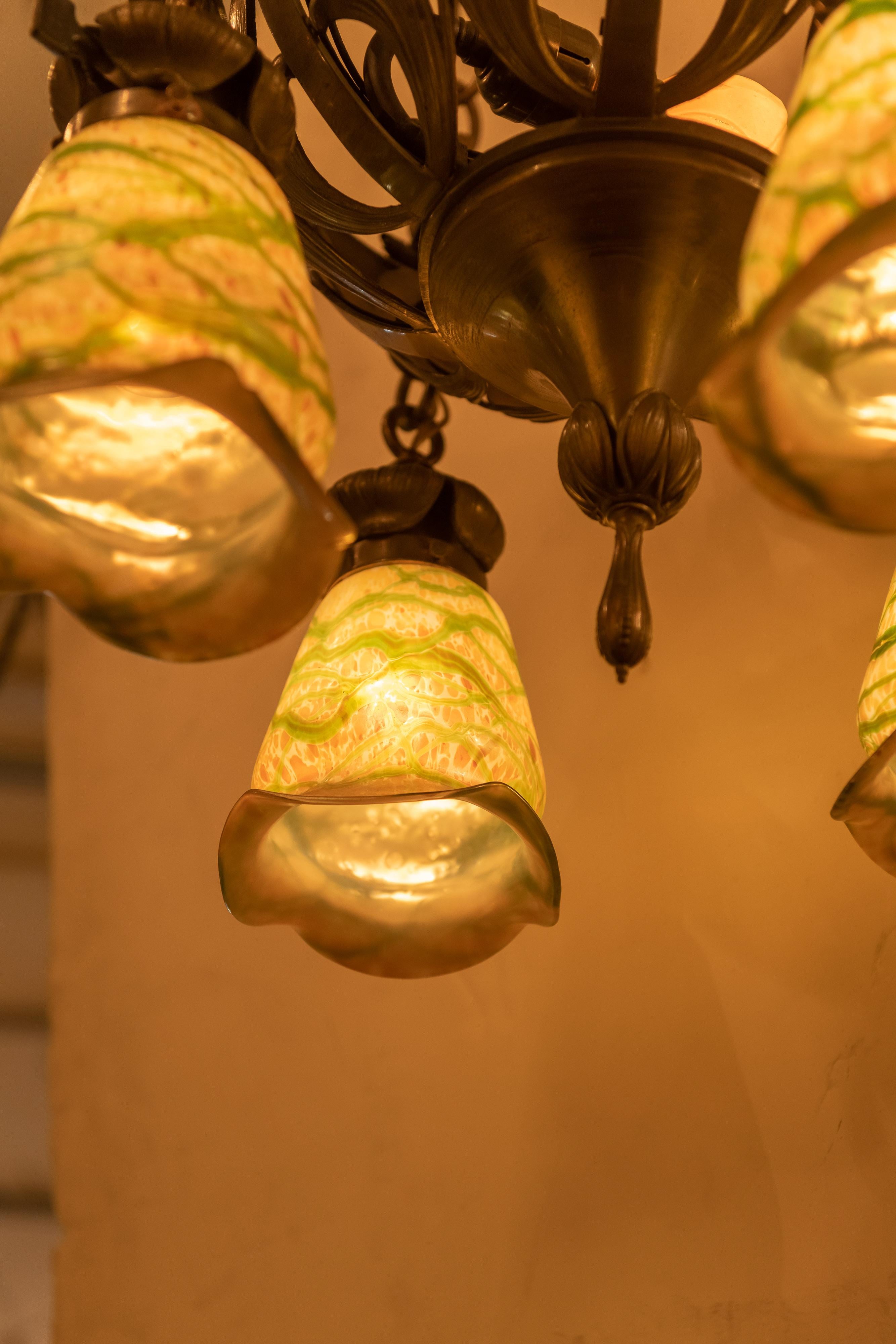 Hand-Crafted Art Nouveau Bronze 4-Arm Chandelier with 4 Hand Blown Glass Shades, circa 1900