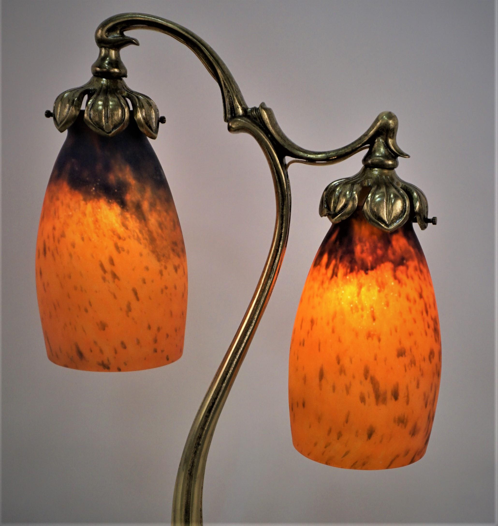 Beautiful double arm bronze base with blown glass shades table lamp.