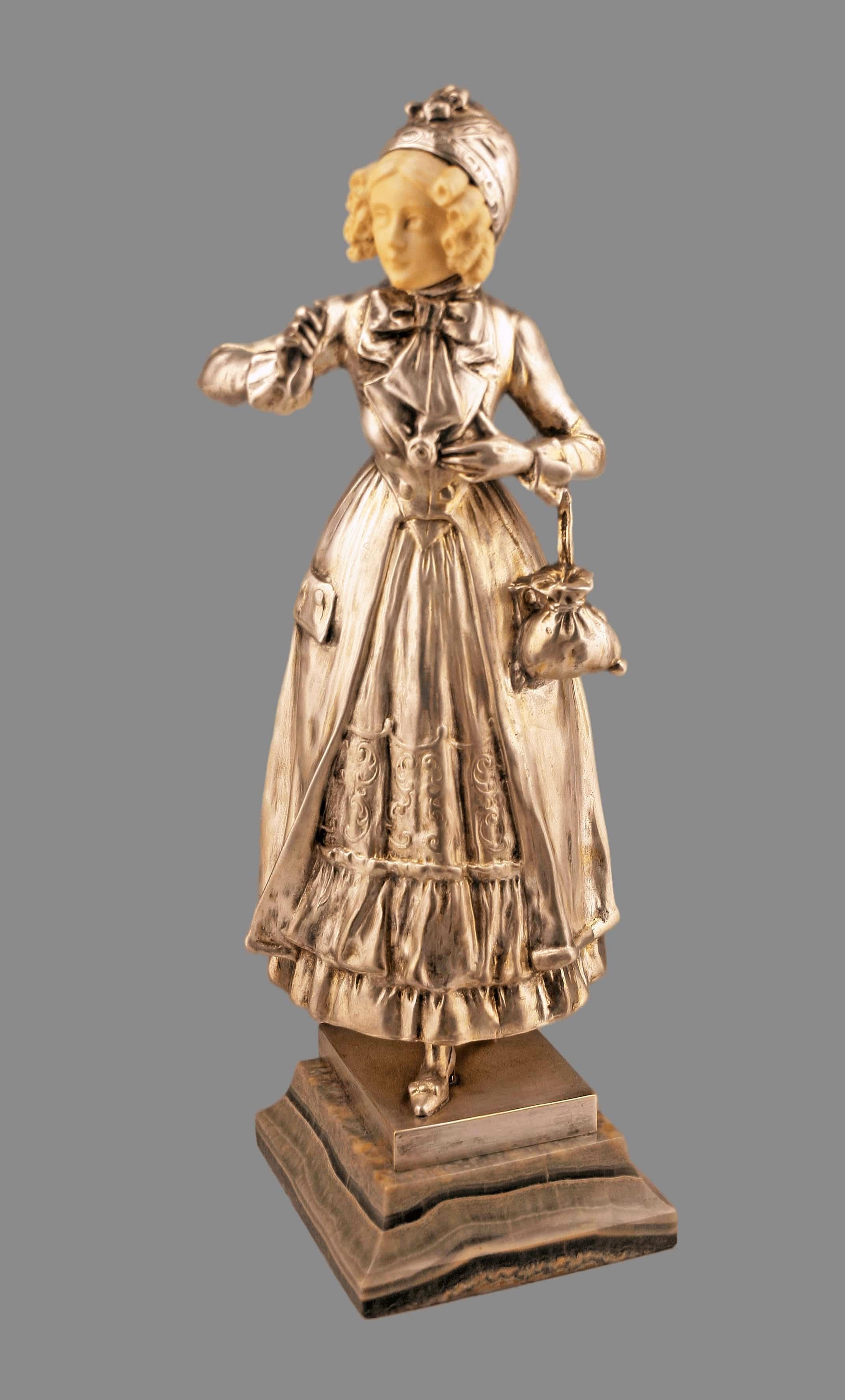 Art Nouveau patinated bronze and ivory sculpture of a girl on a marble plinth by austrian author Ferdinand Lugerth

By: Ferdinand Lugerth
Material: bronze, ivory, marble, copper, metal, silver
Technique: patinated, cast, carved, hand-carved,