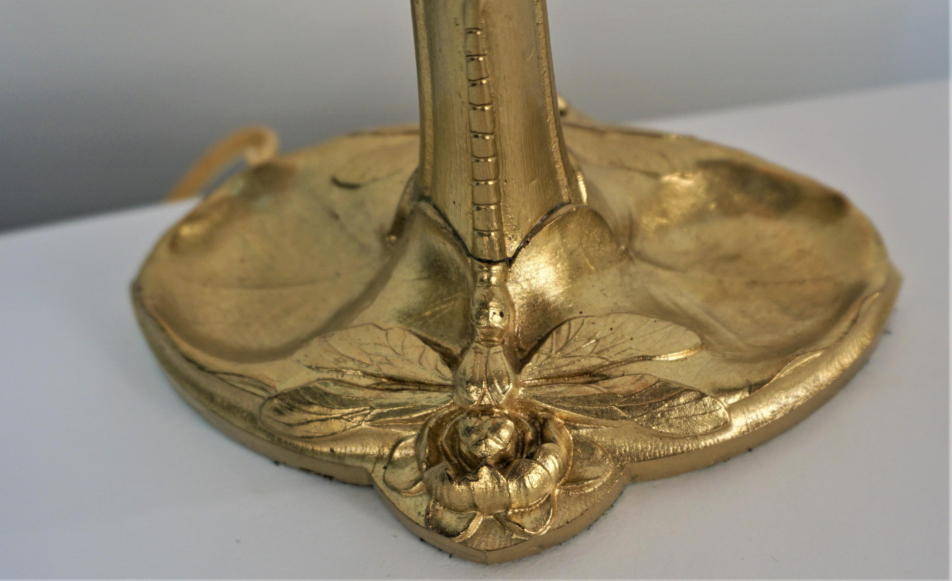 Bronze art nouveau base with water lily and dragonfly table lamp, beautiful blown glass shade.