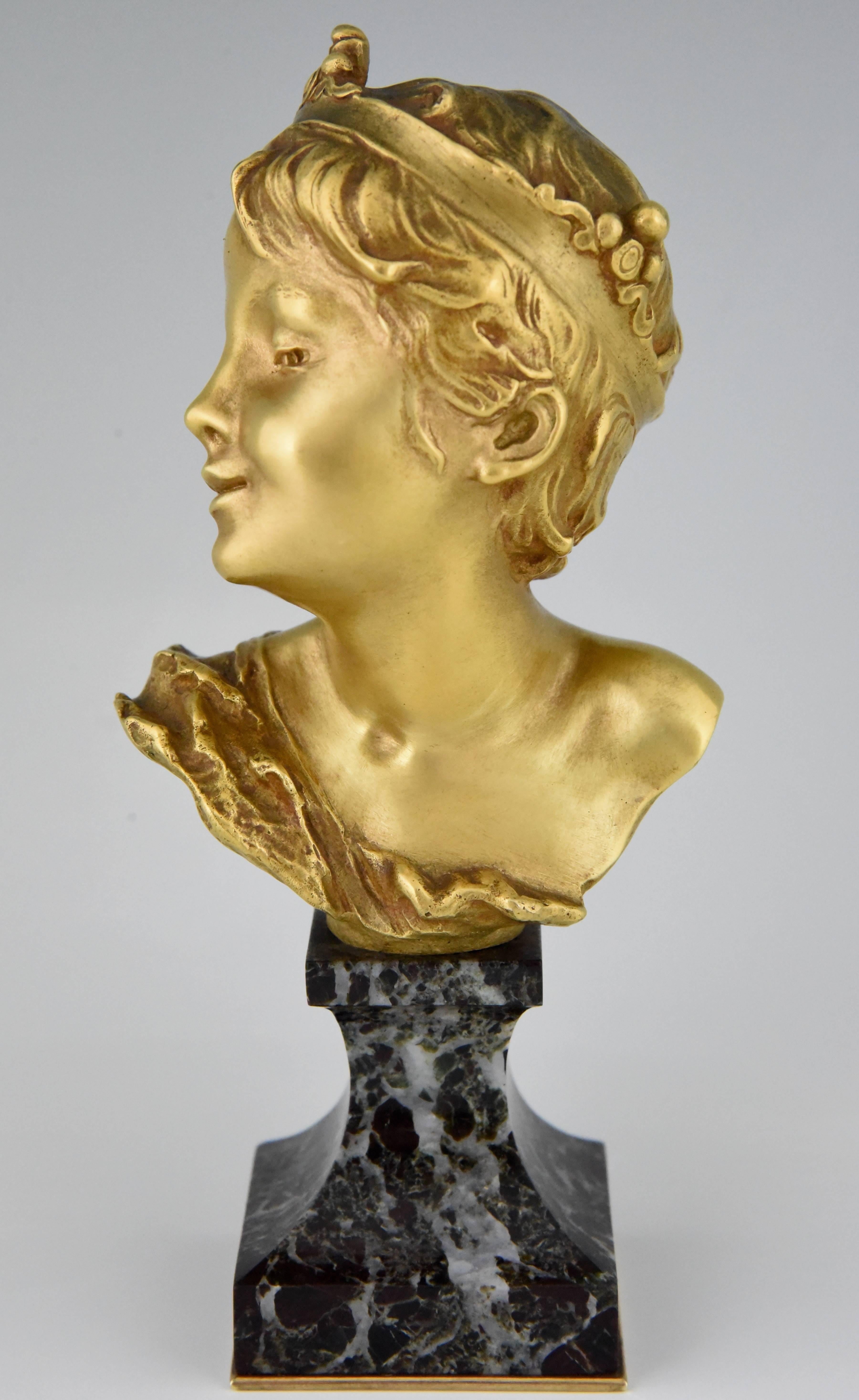 Lovely gilt bronze bust of a boy titled “Petit Roi” or “Little King” by Raoul Larche, a well know french artist. Mounted on a marble and bronze base. Signed and with foundry mark Siot, Paris.