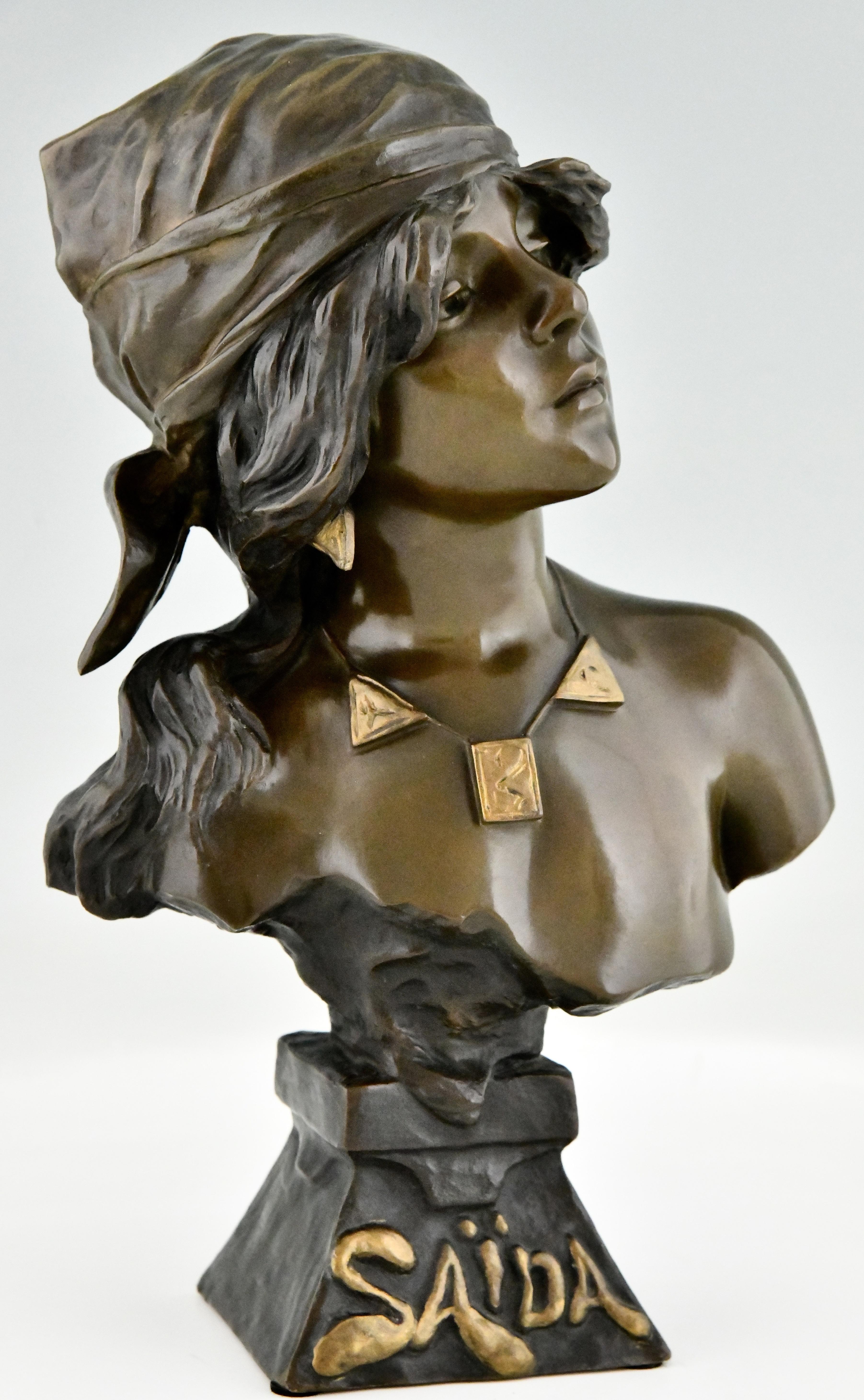 Art Nouveau bronze bust of a girl Saïda by Emmanuel Villanis.
With the foundry seal of the Société des bronzes de Paris.
AP for the founder
Numbered 5189
Bronze with multicolor patina. 
France 1890. 
Illustration of this model on page  of