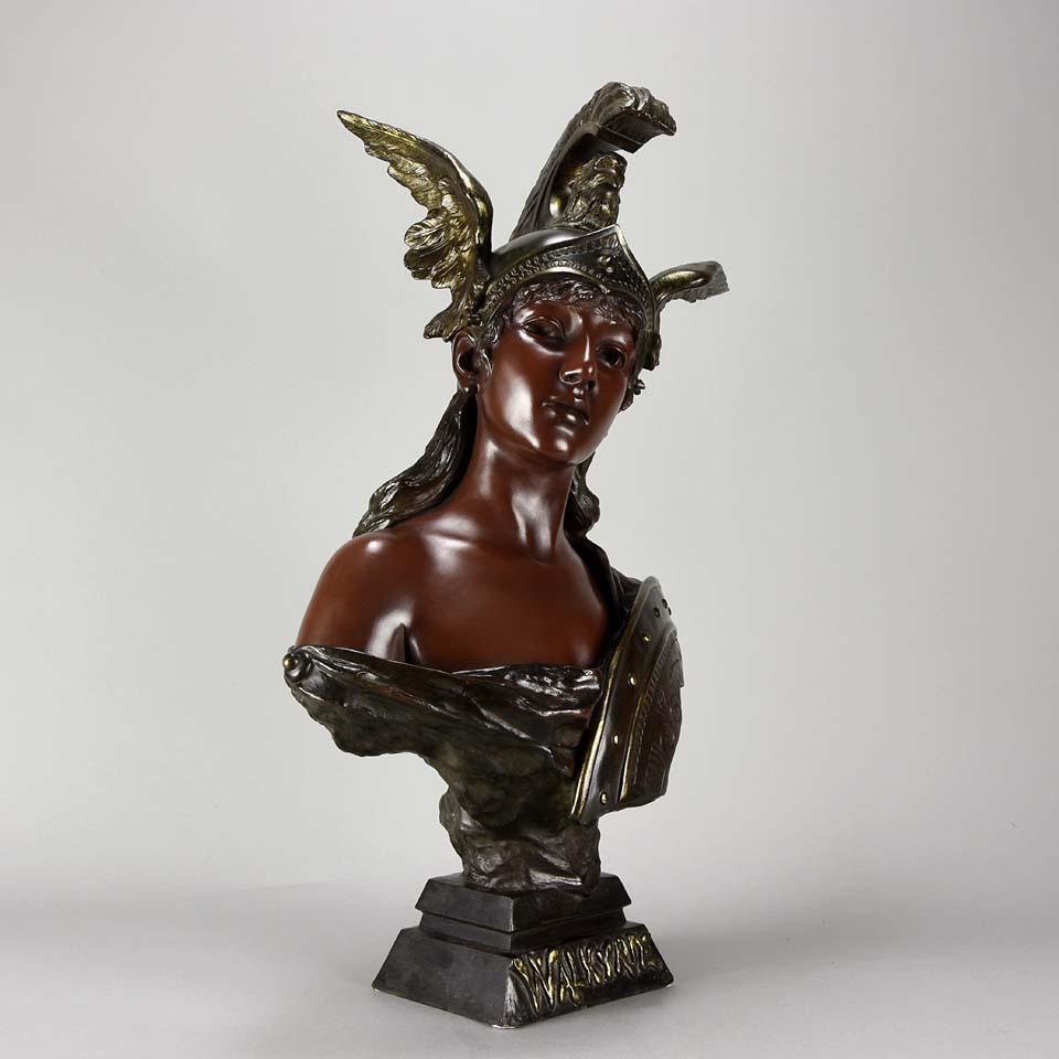 An impressive French late 19th century Art Nouveau bronze bust of a beautiful young warrior woman, the famous character from Wagner’s work, wearing winged helmet and holding a battle shield. The bronze with rich red/brown variegated patination and