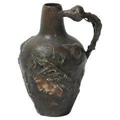 Fanciulla in bronzo Art Nouveau con cardo mariano firmata Jeanne Jozon