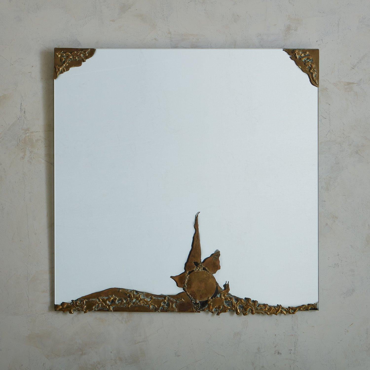 A 1970s French Art Nouveau style wall mirror featuring a partial textured bronze frame with gorgeous patina. The bronze detailing frames the top corners and extends artfully along the bottom of the mirror. Sourced in France, 1970s. 