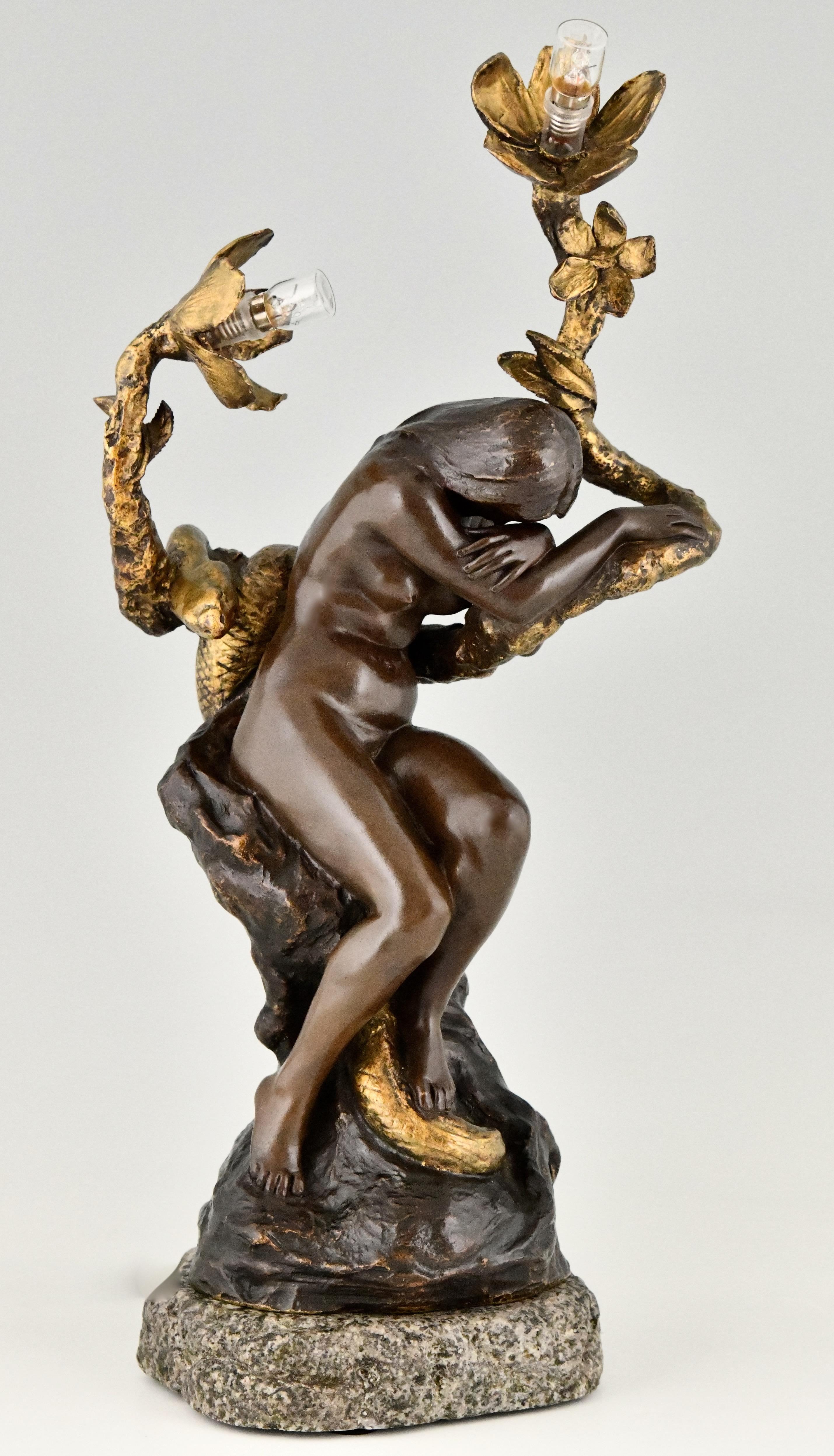 Beautiful Art Nouveau bronze lamp nude with snake and flowers.
By the French sculptor Henri Levasseur (Paris, 1853-1934) 
Patinated bronze on a marble base. 
Literature:
“The Paris salons 1895-1914“ by Alastar Duncan by the Antique Collectors