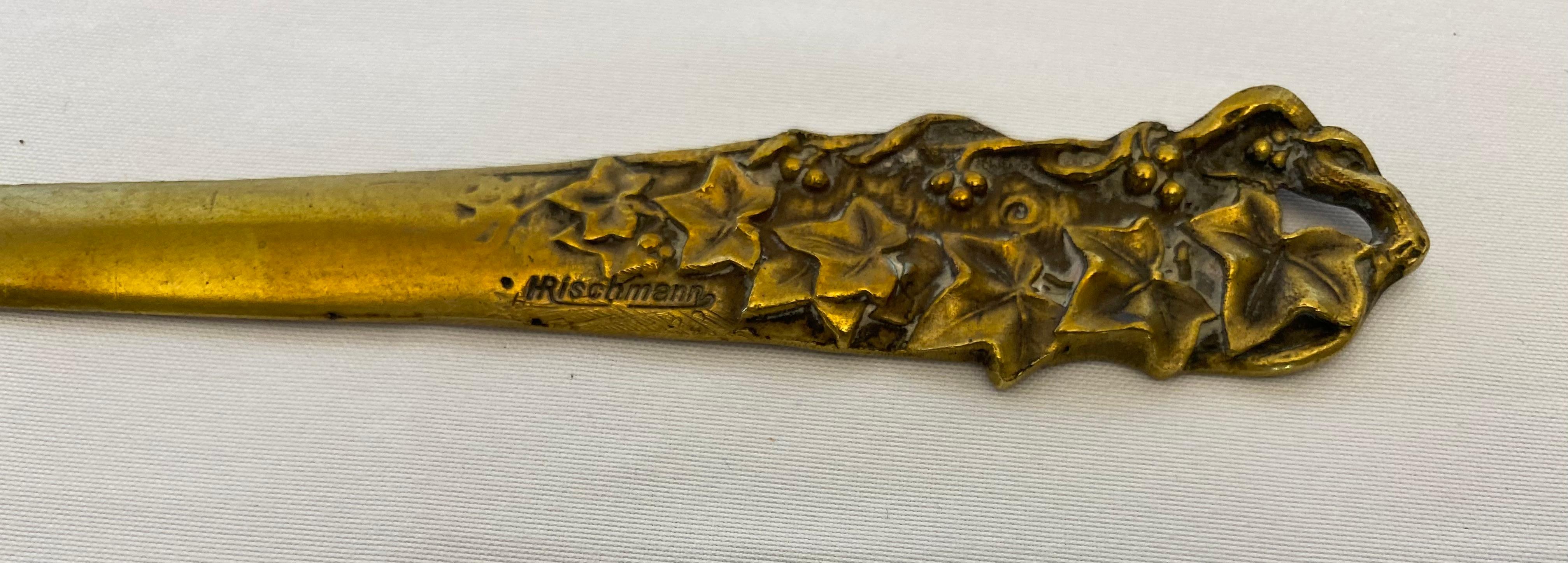 A beautiful bronze letter opener in the Art Nouveau style from France. 
Representing fruits: apples, plums or cherries. 
Designer/Artist: Ernst Rischmann 

Very good antique condition with age appropriate signs of wear.
Wonderful patina.