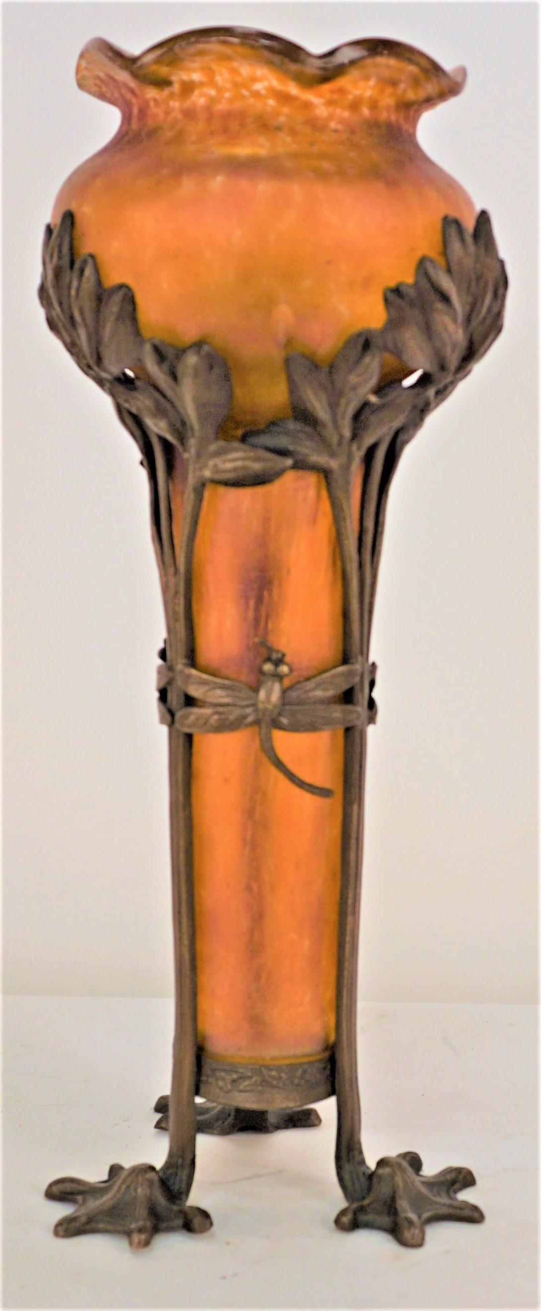 Patinated art nouveau bronze base with hand blown art glass insert vase.  