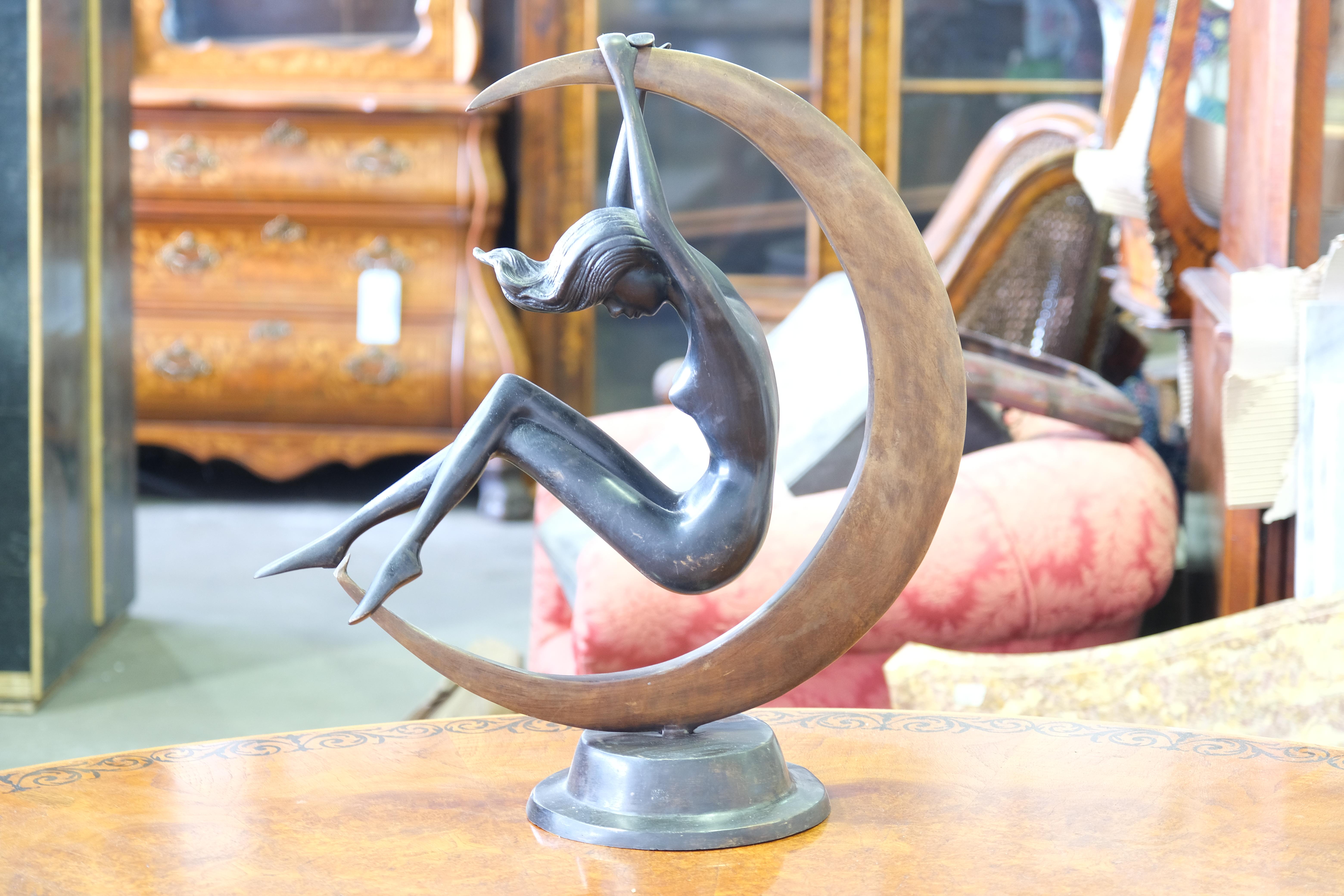 A Gorgeous French Art Nouveau style statue in bronze showing a semi nude moon girl. The Patina is superb to the bronze as is the ornamentation to the moon. A Black marble for pedestal base is smooth and chip free. Perfect for home decoration and