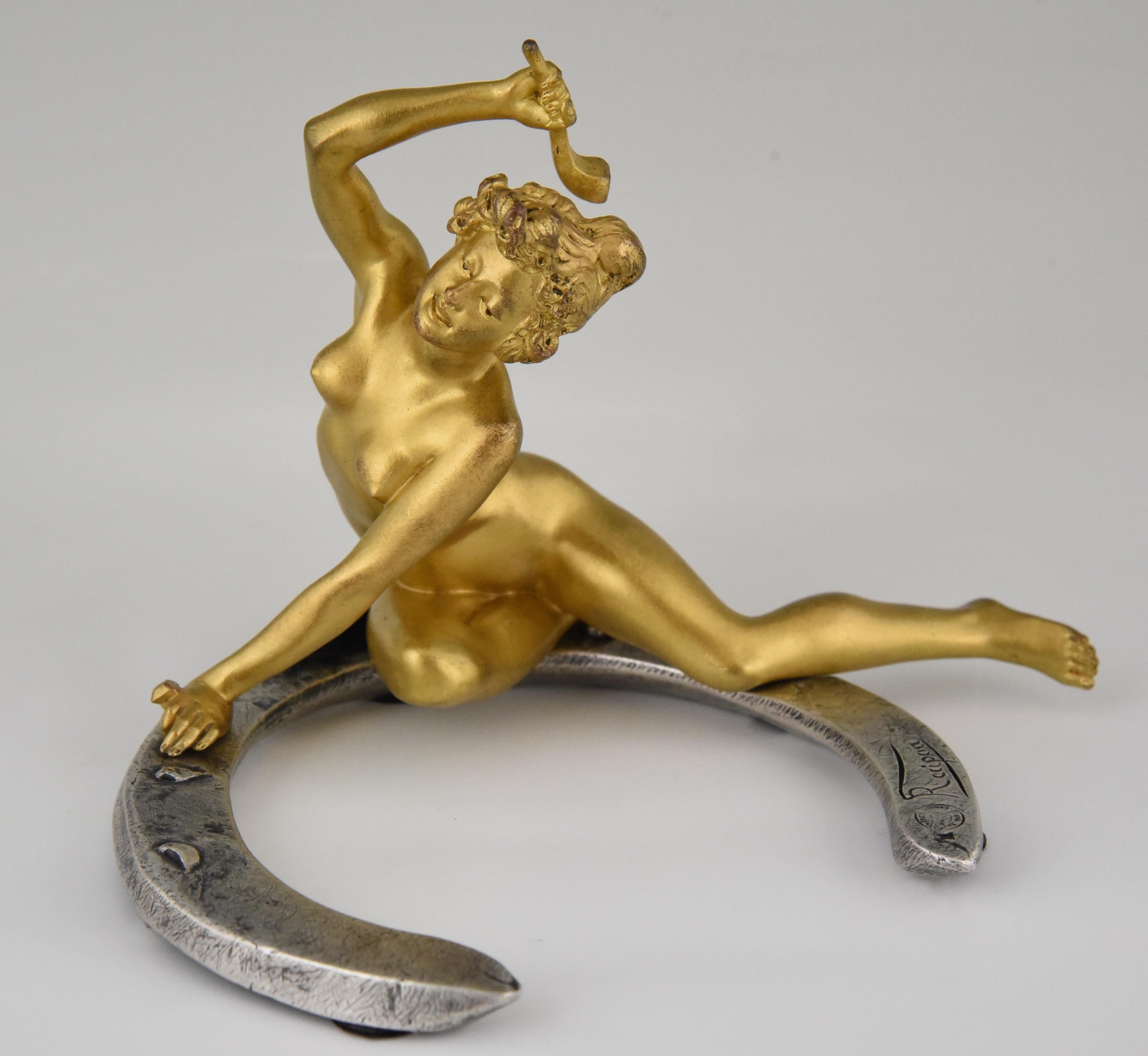 Beautiful Art Nouveau bronze sculpture of a nude sitting on a horseshoe in gilt and silvered bronze. Signed by the French artist Georges Récipon with the Susse Freres foundry seal. France 1896.
This bronze is illustrated in
?