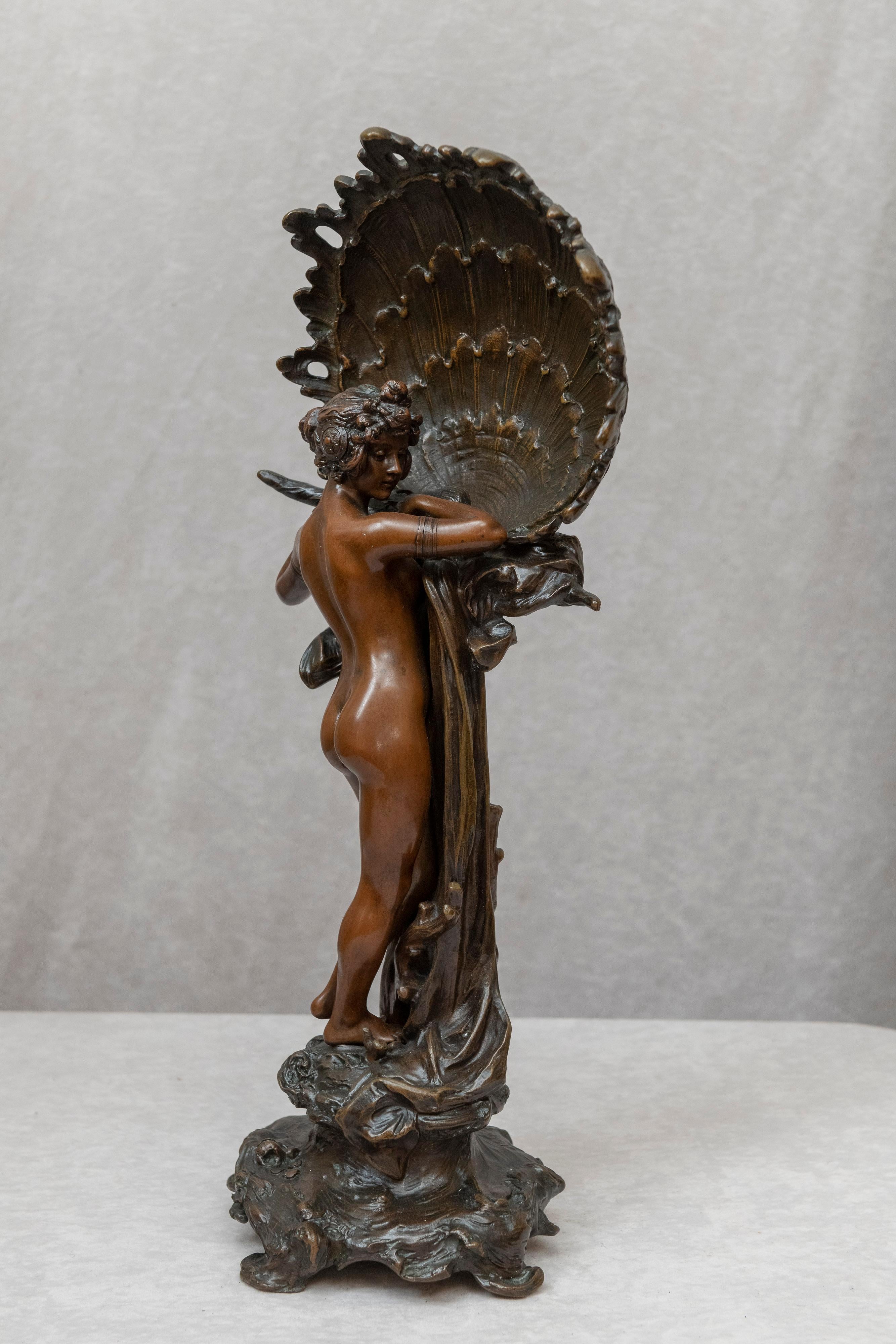 This 2 color patinated bronze of a nude is certainly one of our best. She is beautiful and the light brown against the dark brown color is dynamic to the eye. It's really as about as good as it gets in period Art Nouveau. We have had a few