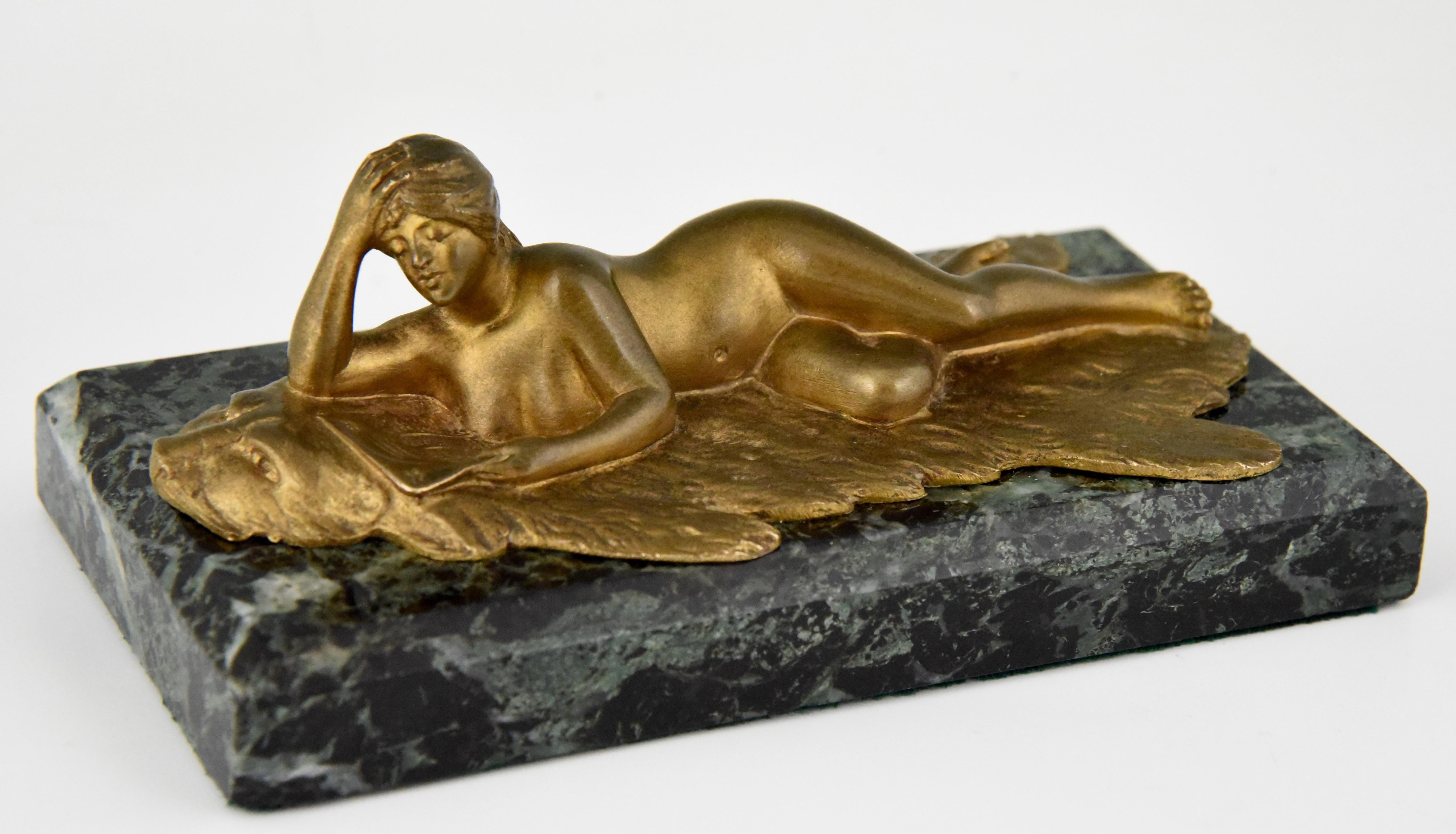 Art Nouveau bronze sculpture or paperweight modelled as a reading nude on a bear rug. The bronze is signed by the artist Jean Garnier and with founders signature C. Villain.
Literature:
“Etains 1900” Philippe Dahan, les éditions de l'amateur. ?.