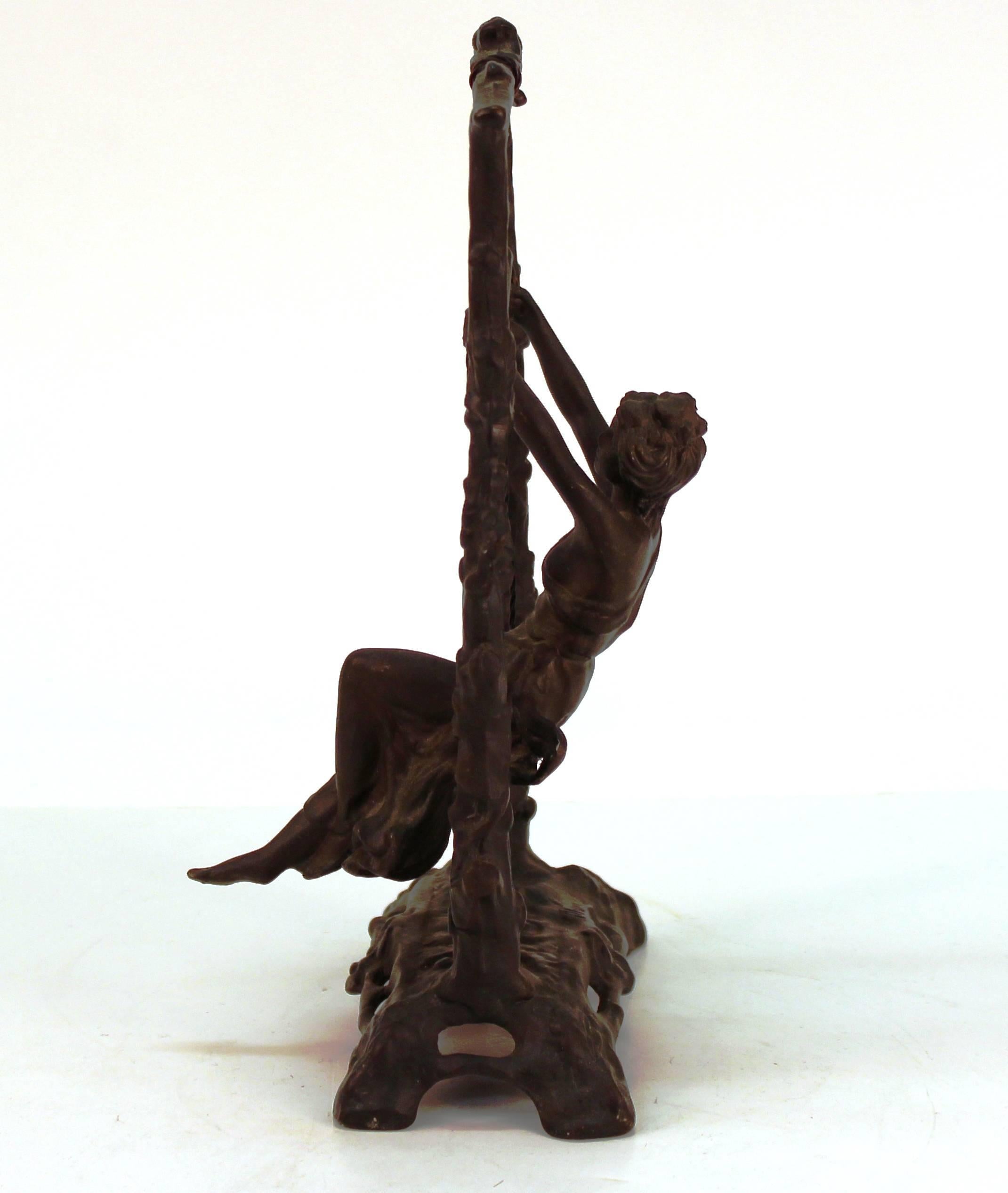 girl on a swing sculpture