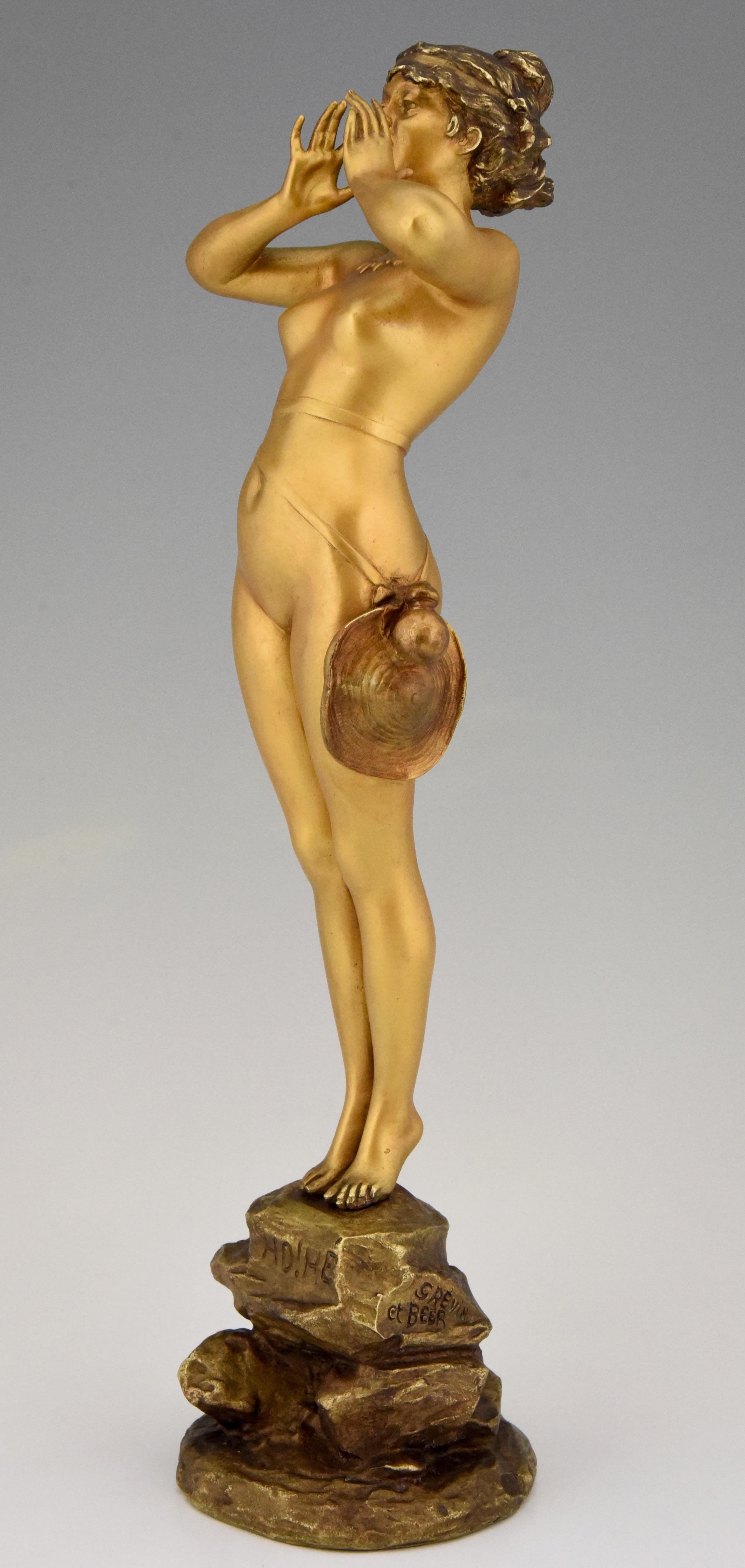 Art Nouveau bronze sculpture standing nude lady calling.
Title: “Ho, he” or Calling girl.
Signed by Alfred Grevin 1827-1892 and Friedrich Beer.
France, circa 1880. 

The same sculpture is in the collection of the Museum of Chambery. ??This