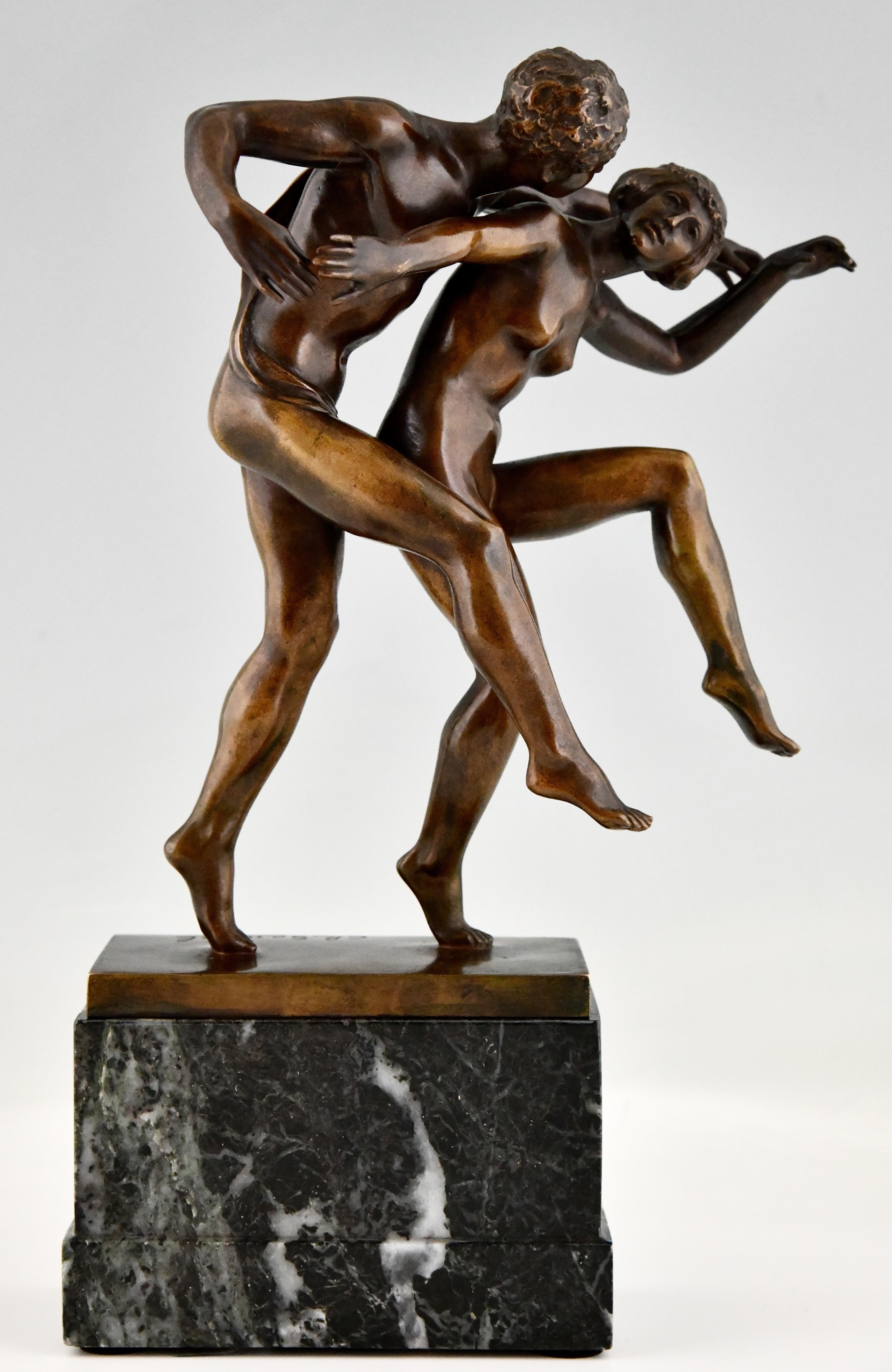 Art Nouveau bronze sculpture dancing nude couple, La Danse by Charles Samuel. 
Patinated bronze on a marble base. 
Belgium ca. 1900. 
This bronze is illustrated in:
Beeldhouwkunst in België, Engelen Marx.
More information about the