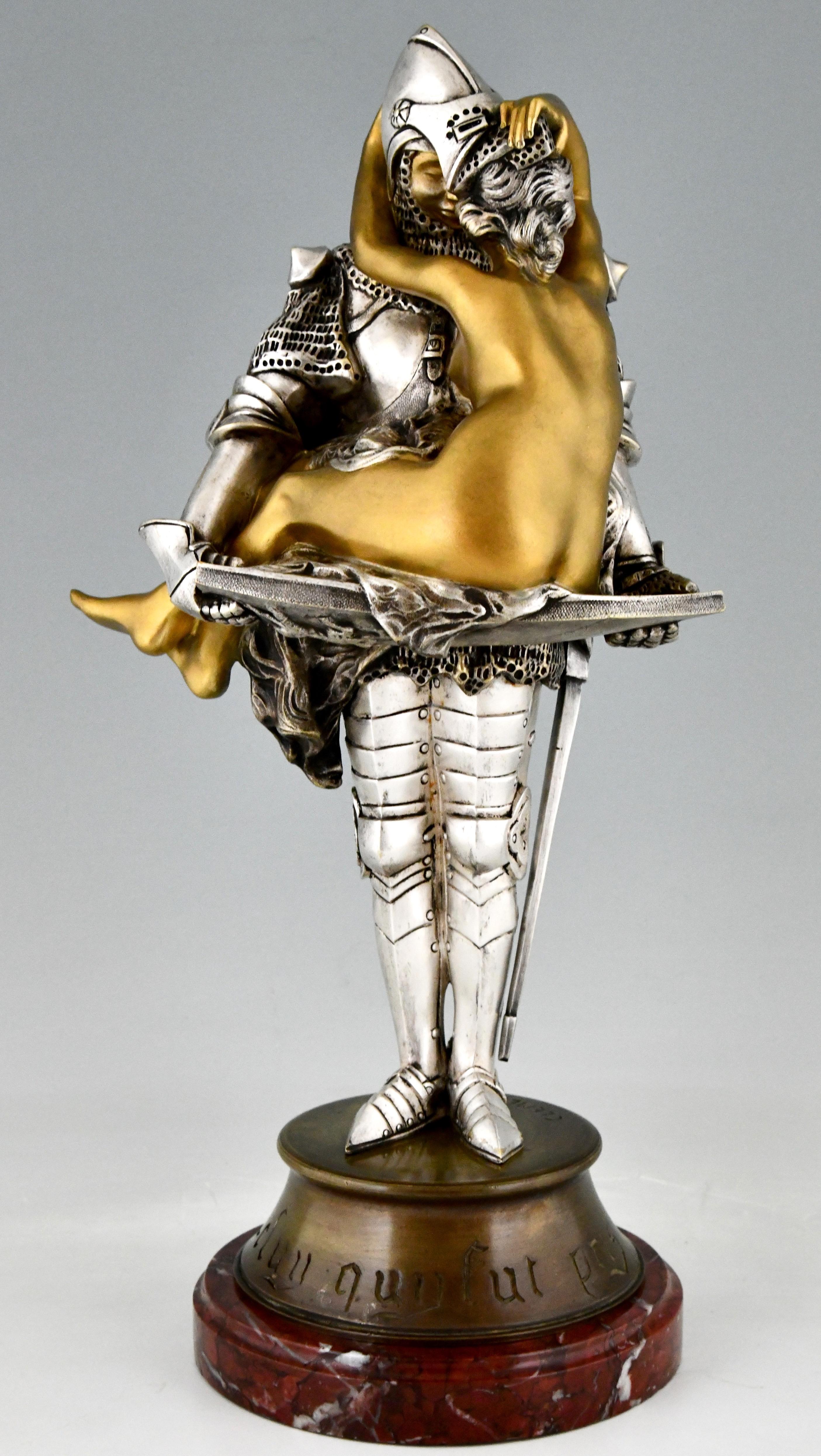 Art Nouveau bronze sculpture of a knight holding a seated nude on his shield signed by François André Clémencin, who lived in France 1878/1950. Bronze, silvered and gilt patina on a red marble base. France ca. 1900 Title: Celui qui fut pris or The