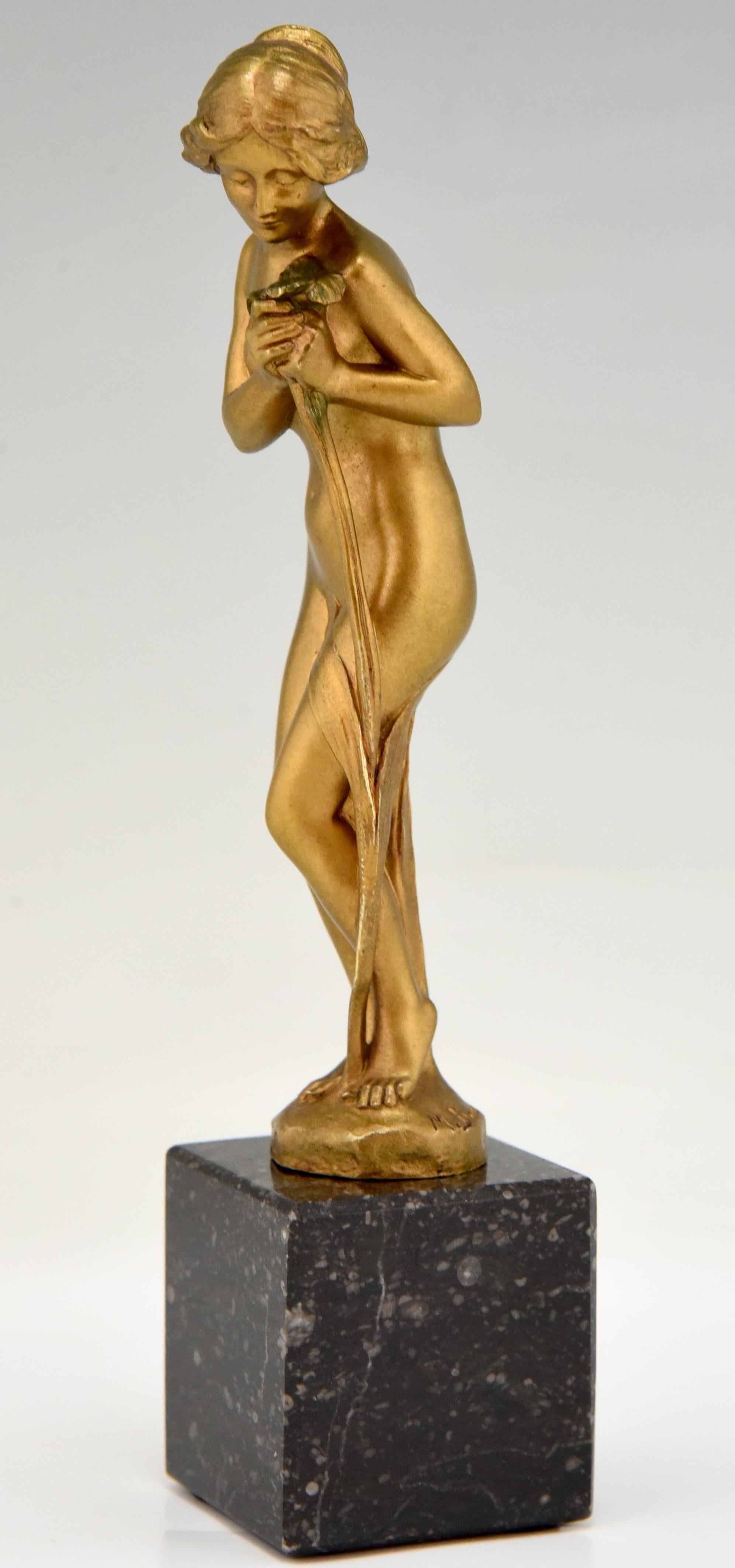 Art Nouveau bronze sculpture of a nude holding a flower. 
The figure is signed by the French artist Maurice Bouval -1863-1916-
and stands on a marble base, with foundry mark of Rollet, Paris. 
Literature:
“Bronzes, sculptors and founders” by H.